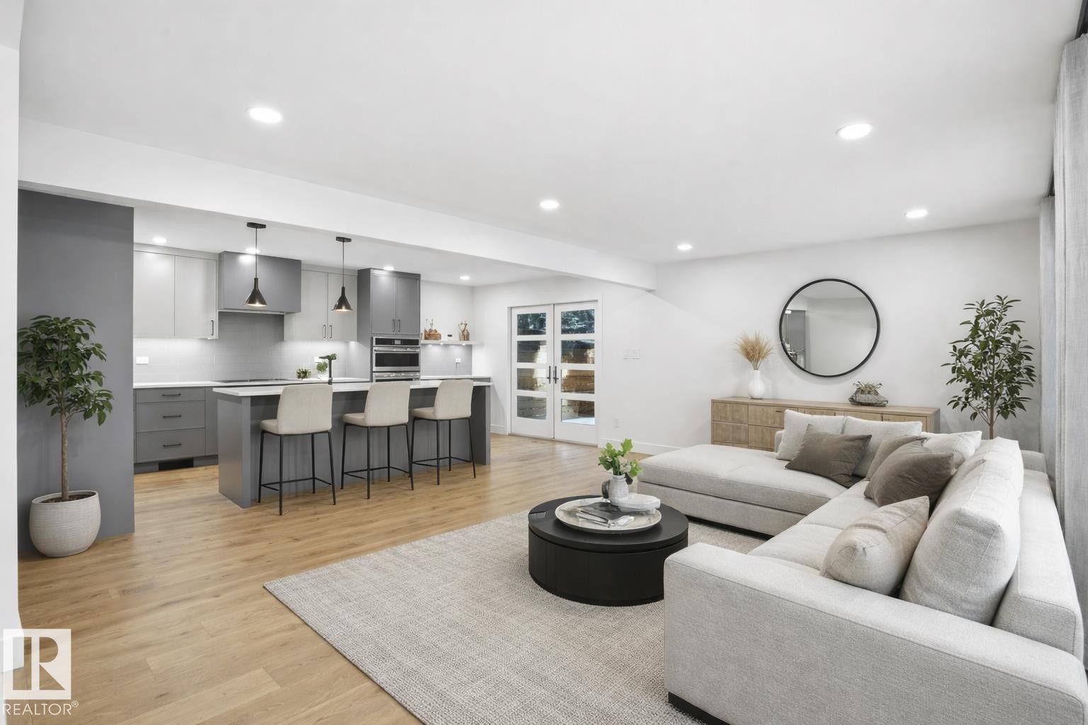 Living area with light wood-type flooring and recessed lighting - 14604 Mackenzie Drive, Edmonton, AB - Indoor Photo Showing Other Room