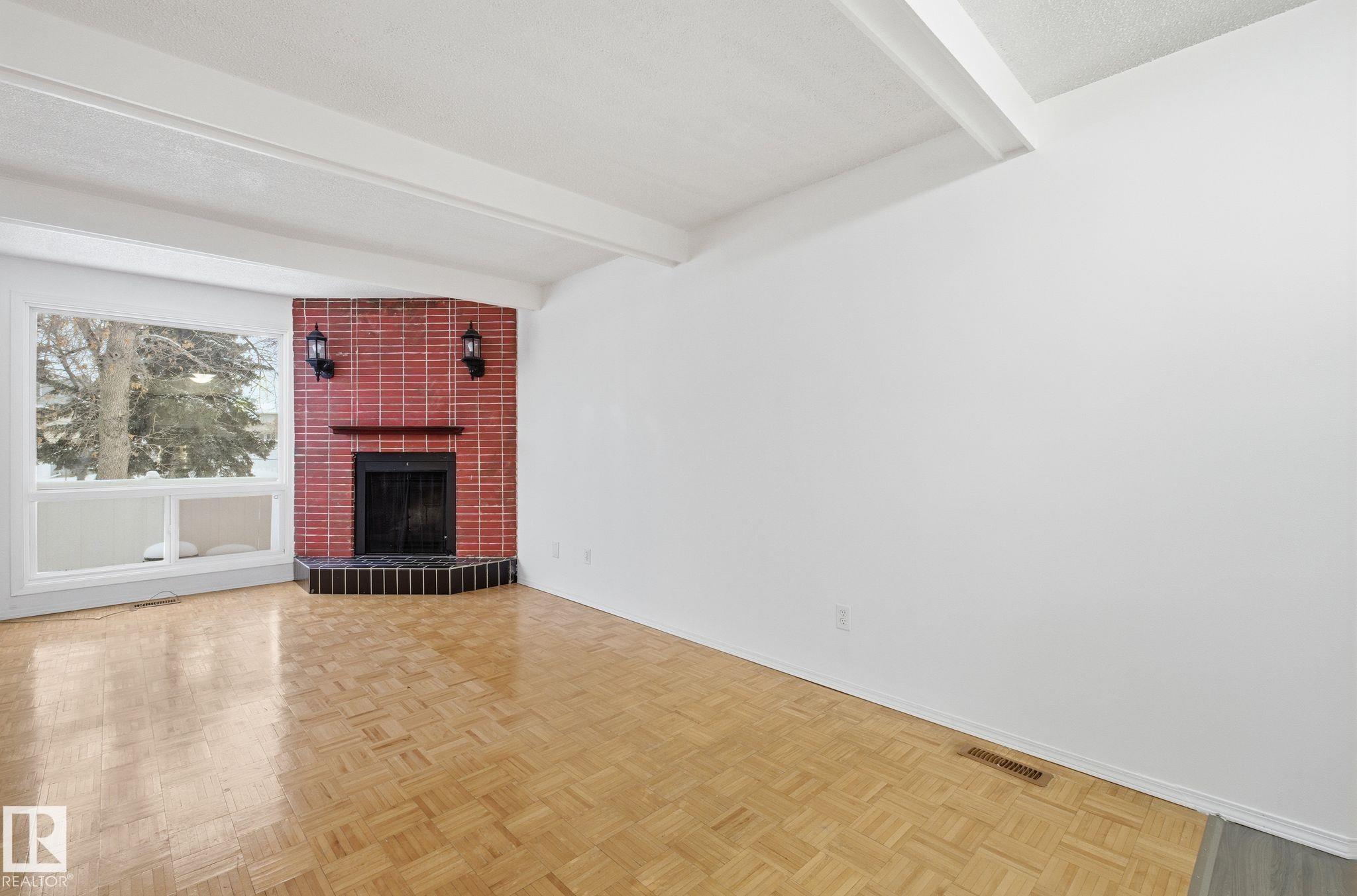 Edmonton, AB - Indoor Photo Showing Other Room With Fireplace