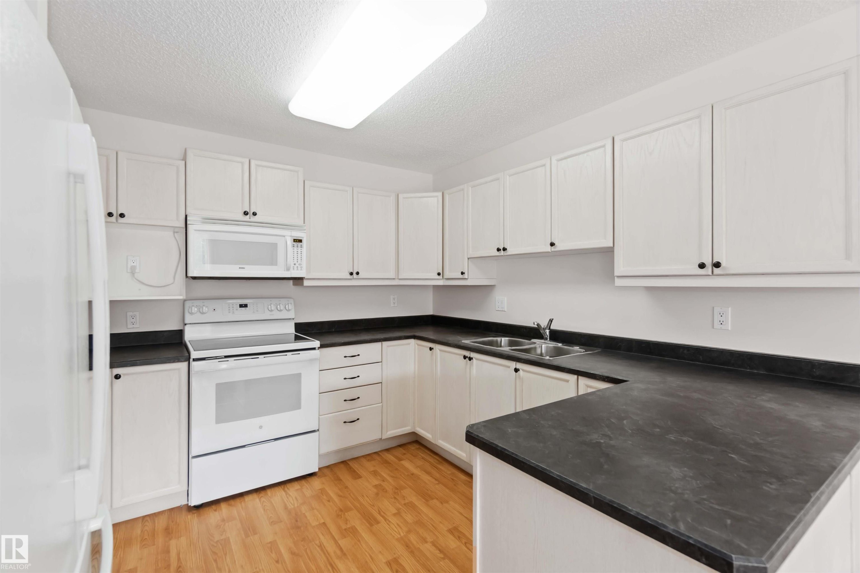 312 15499 Castle Downs Road, Edmonton, AB - Indoor Photo Showing Kitchen With Double Sink