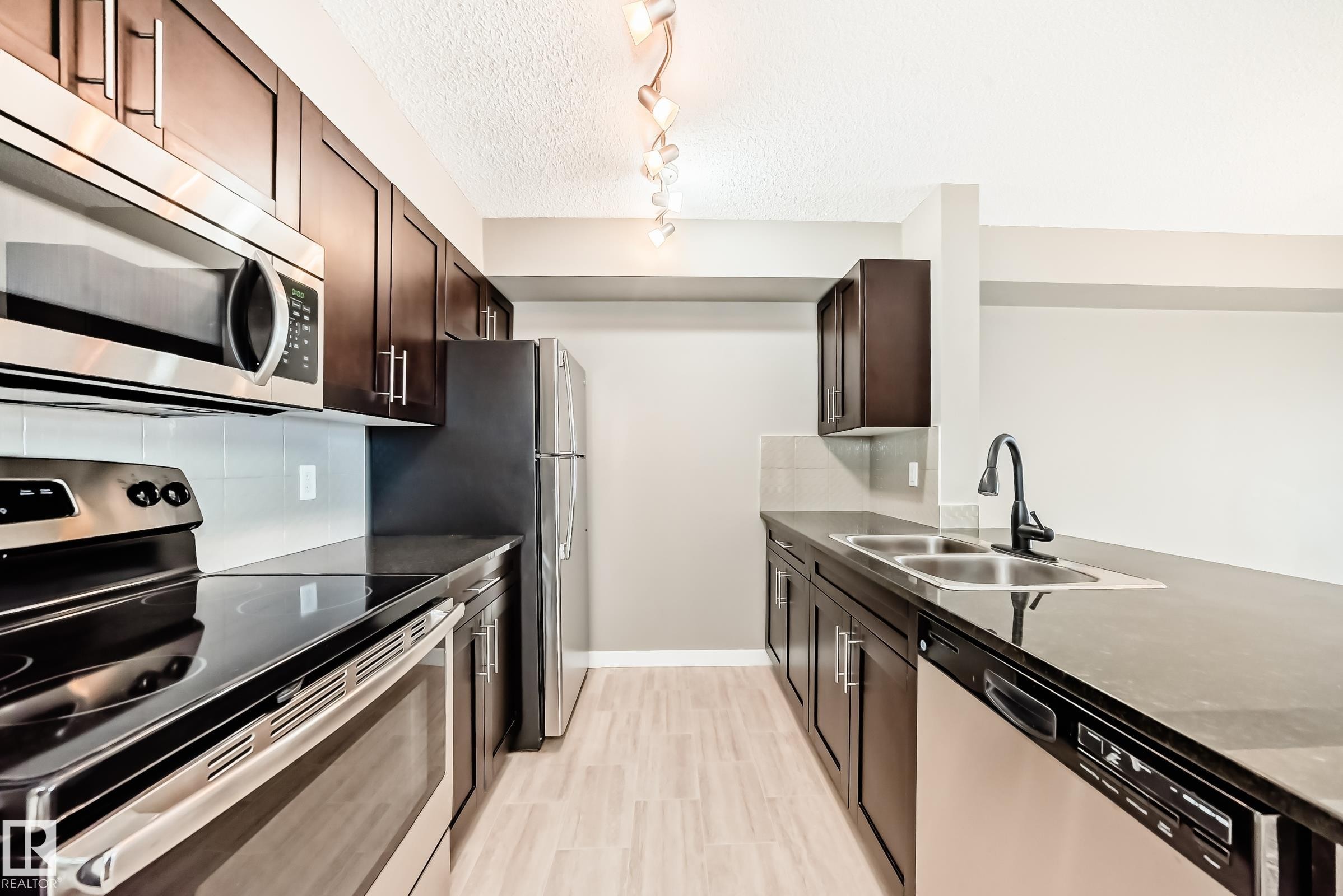 226 1510 Watt Drive, Edmonton, AB - Indoor Photo Showing Kitchen With Stainless Steel Kitchen With Double Sink