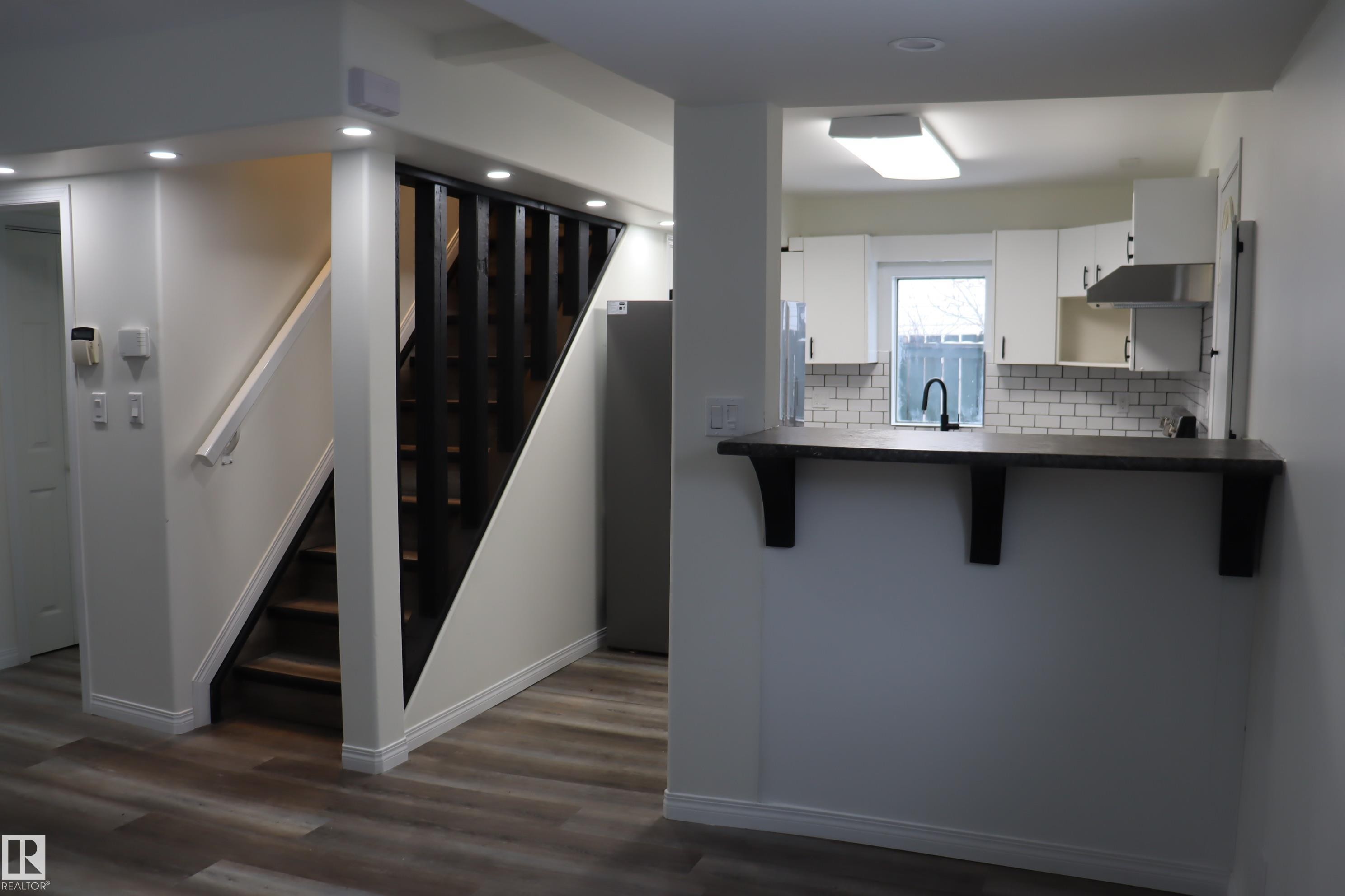 With Eating Bar - 4508 52 St., Wetaskiwin, AB - Indoor Photo Showing Kitchen