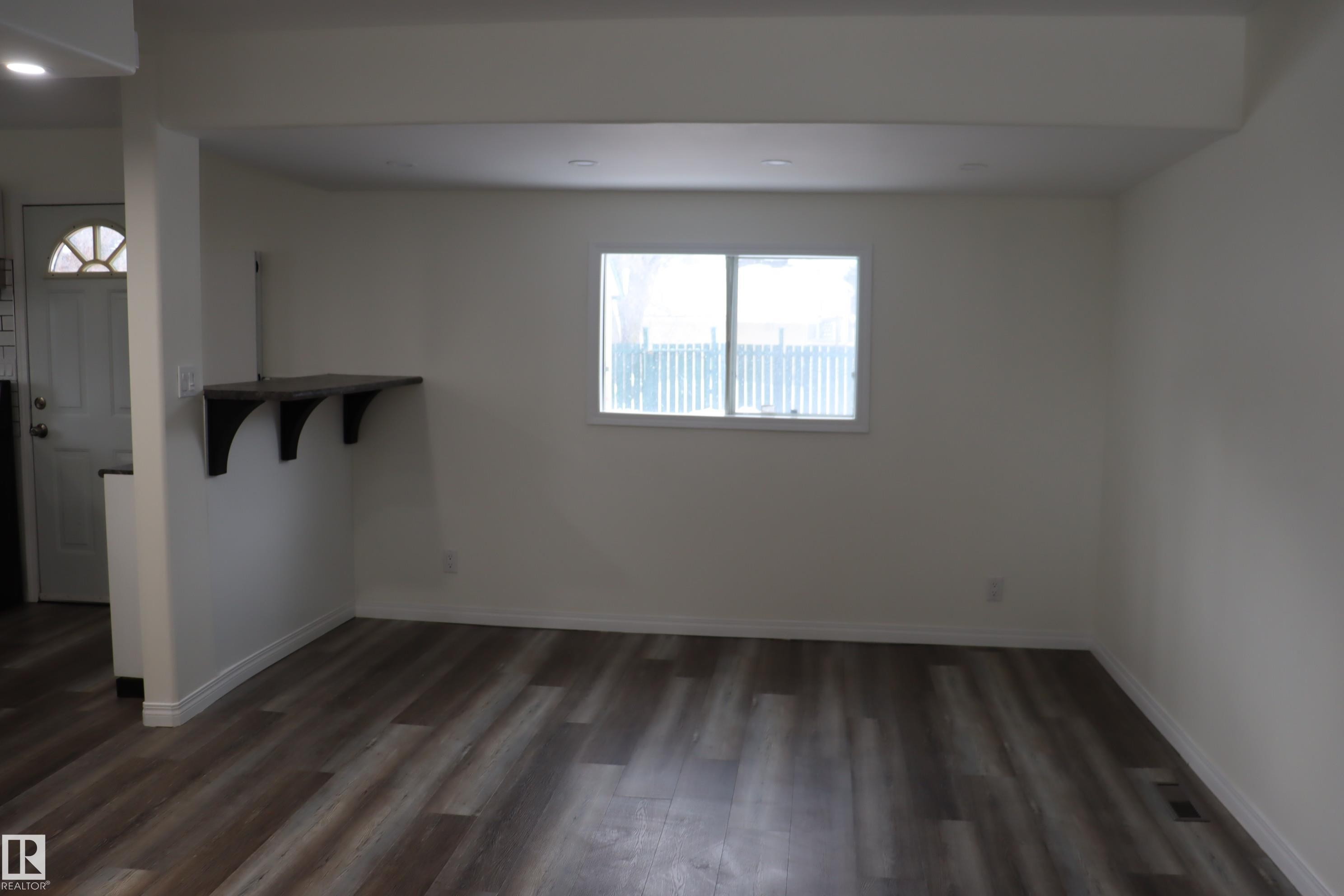 Enter into the home with living room at the front of the house - 4508 52 St., Wetaskiwin, AB - Indoor Photo Showing Other Room