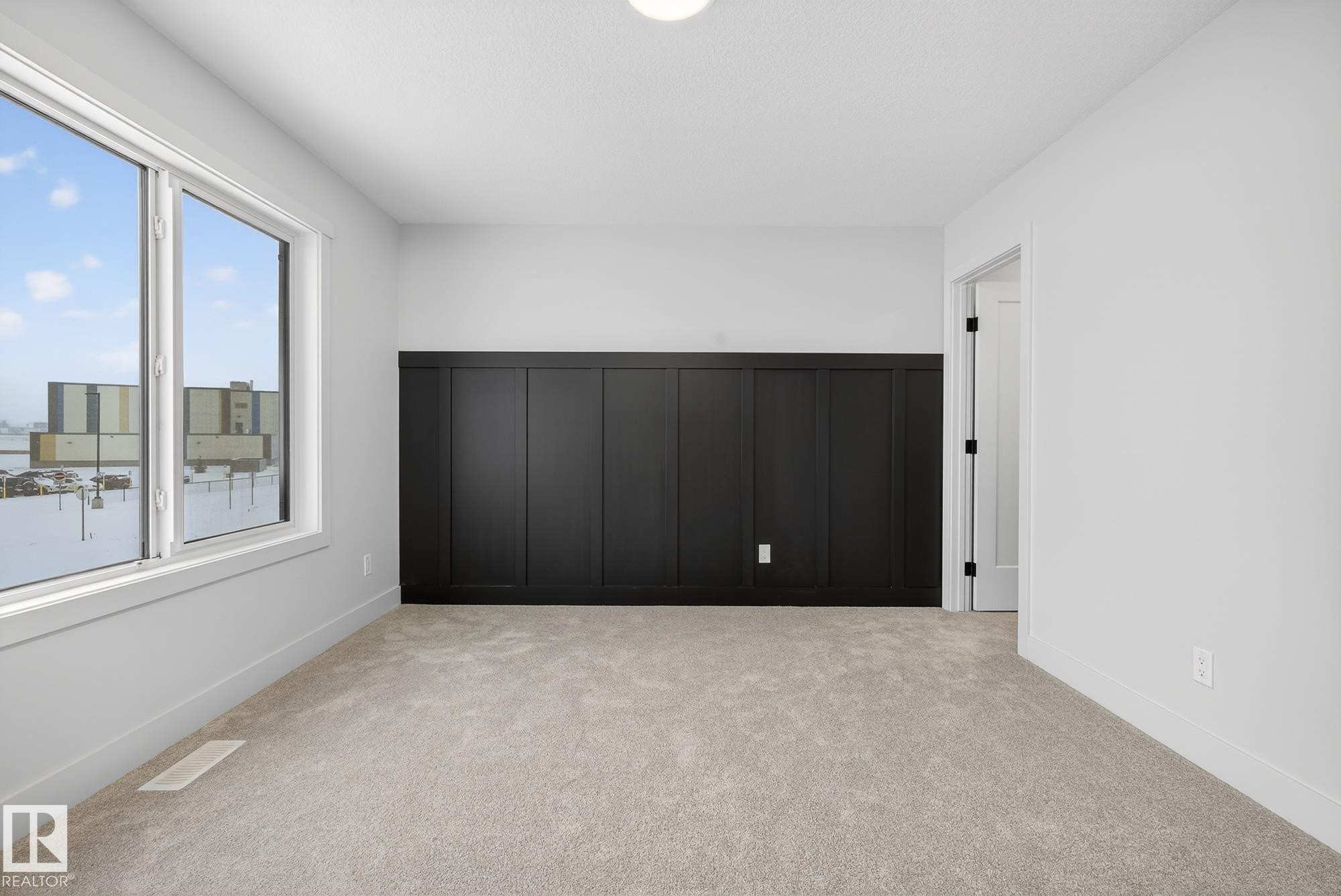 Unfurnished bedroom with light carpet - 119 Brickyard Drive, Stony Plain, AB - Indoor Photo Showing Other Room