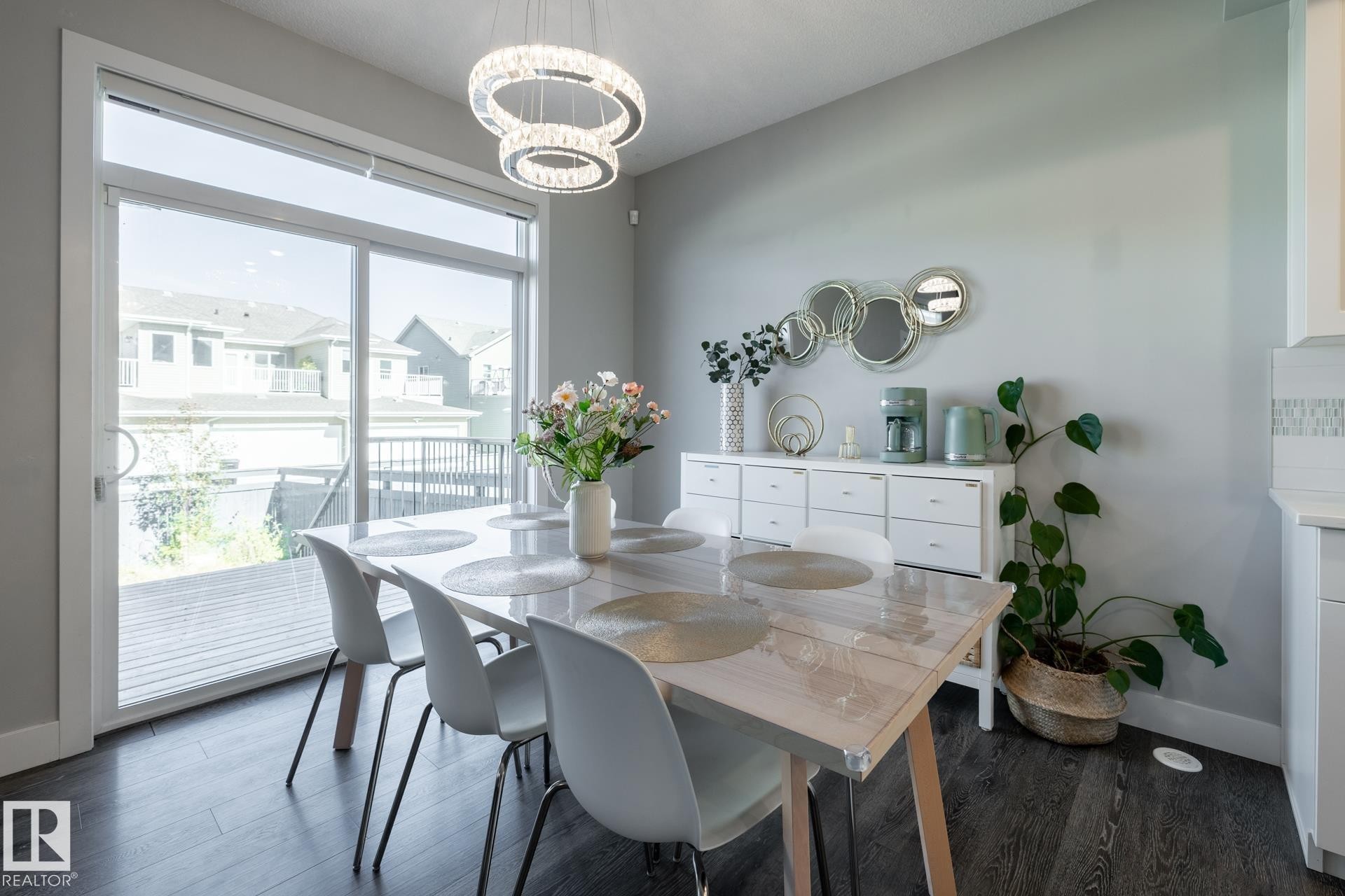 Dining space featuring dark wood finished floors and a chandelier - 1440 Darby Green, Edmonton, AB - Indoor Photo Showing Dining Room