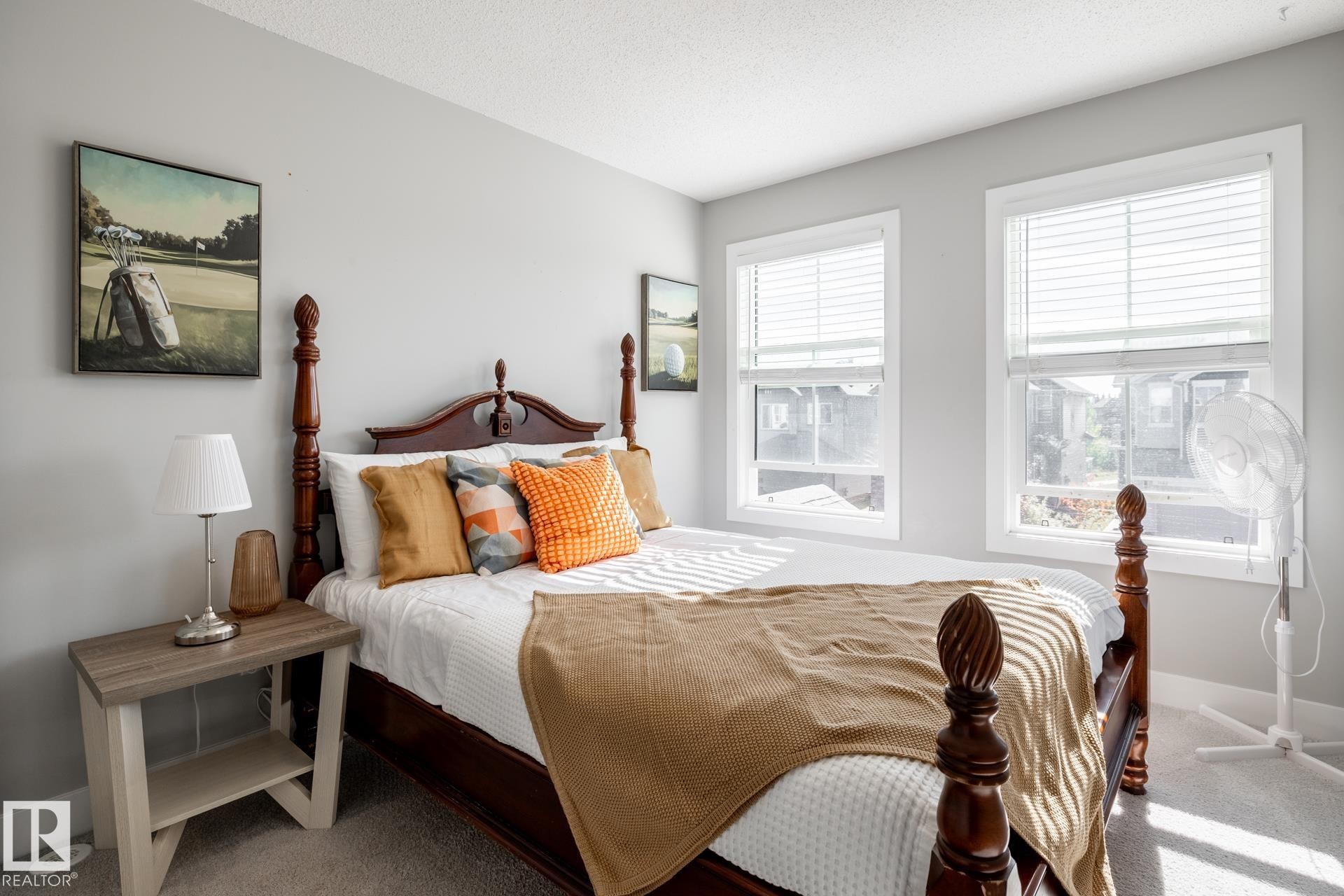 Carpeted bedroom with baseboards and a textured ceiling - 1440 Darby Green, Edmonton, AB - Indoor Photo Showing Bedroom