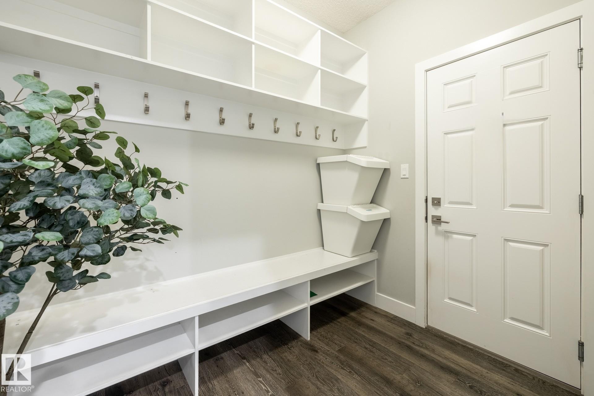 Mudroom with dark wood-type flooring and baseboards - 1440 Darby Green, Edmonton, AB - Indoor Photo Showing Other Room