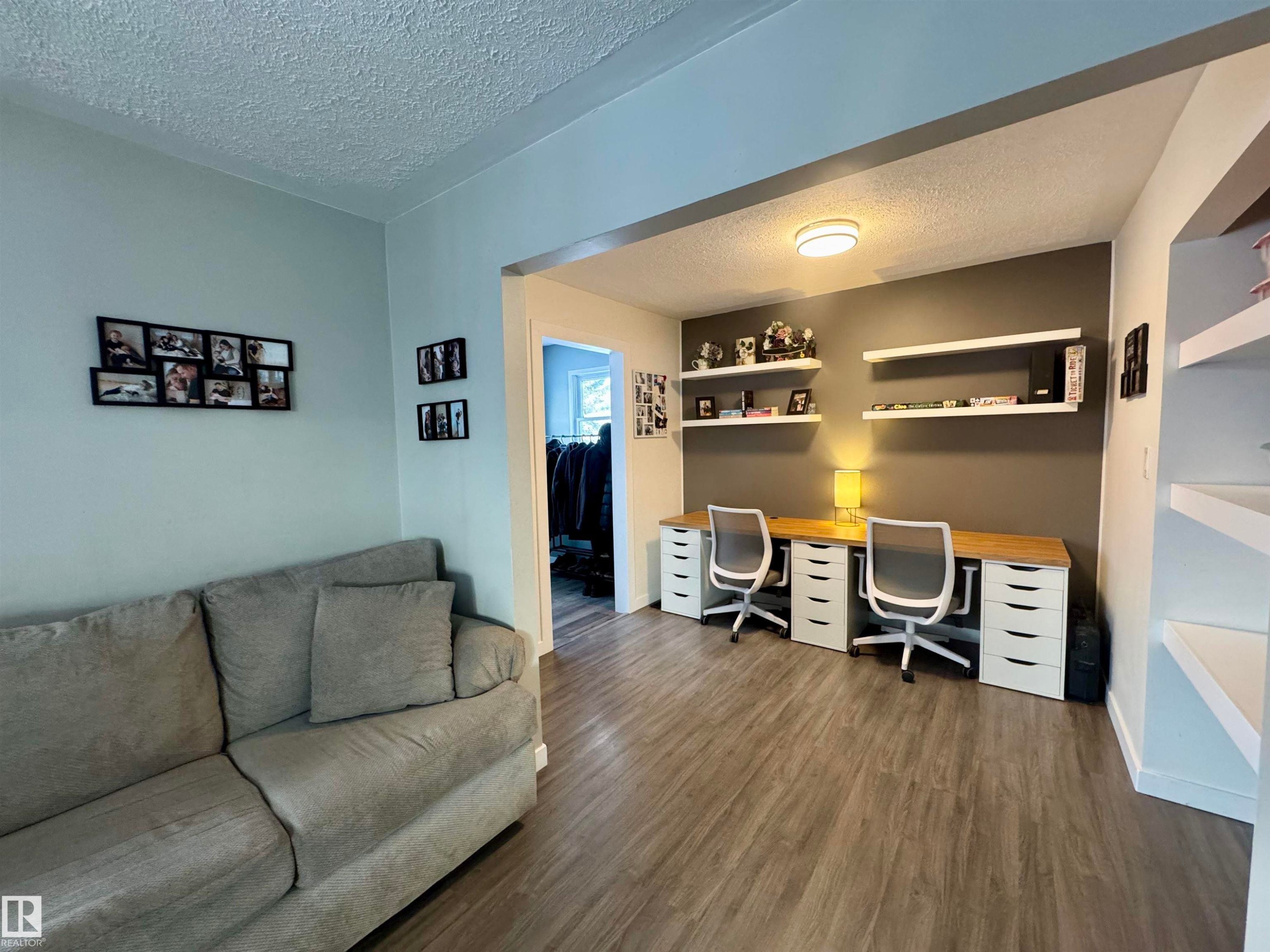 Home office featuring a textured ceiling and dark wood-type flooring - 5140 52 Avenue, Ryley, AB - Indoor