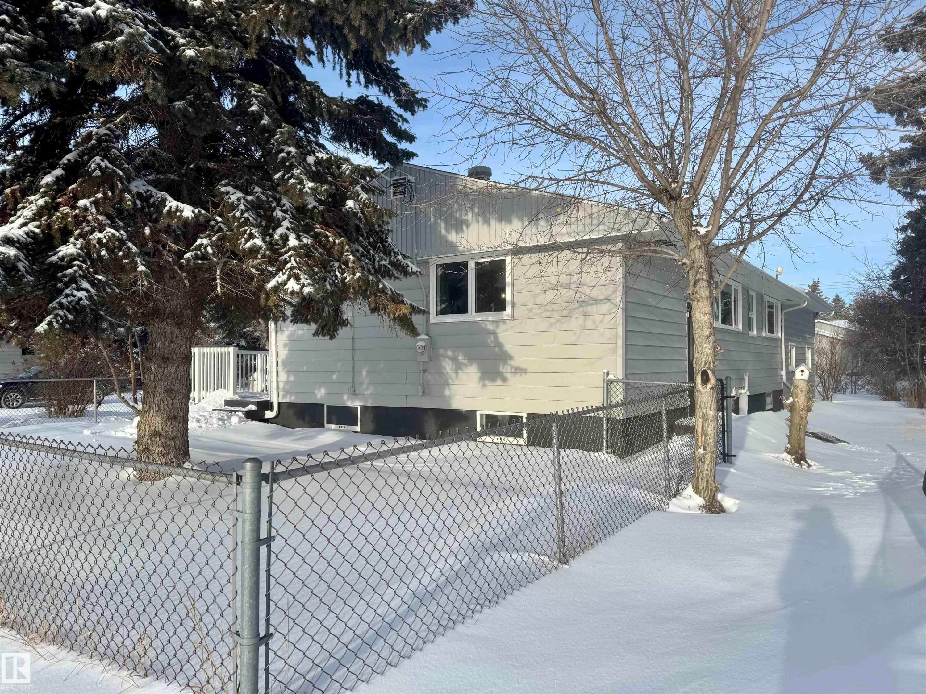 View of snowy exterior - 5140 52 Avenue, Ryley, AB - Outdoor With Deck Patio Veranda