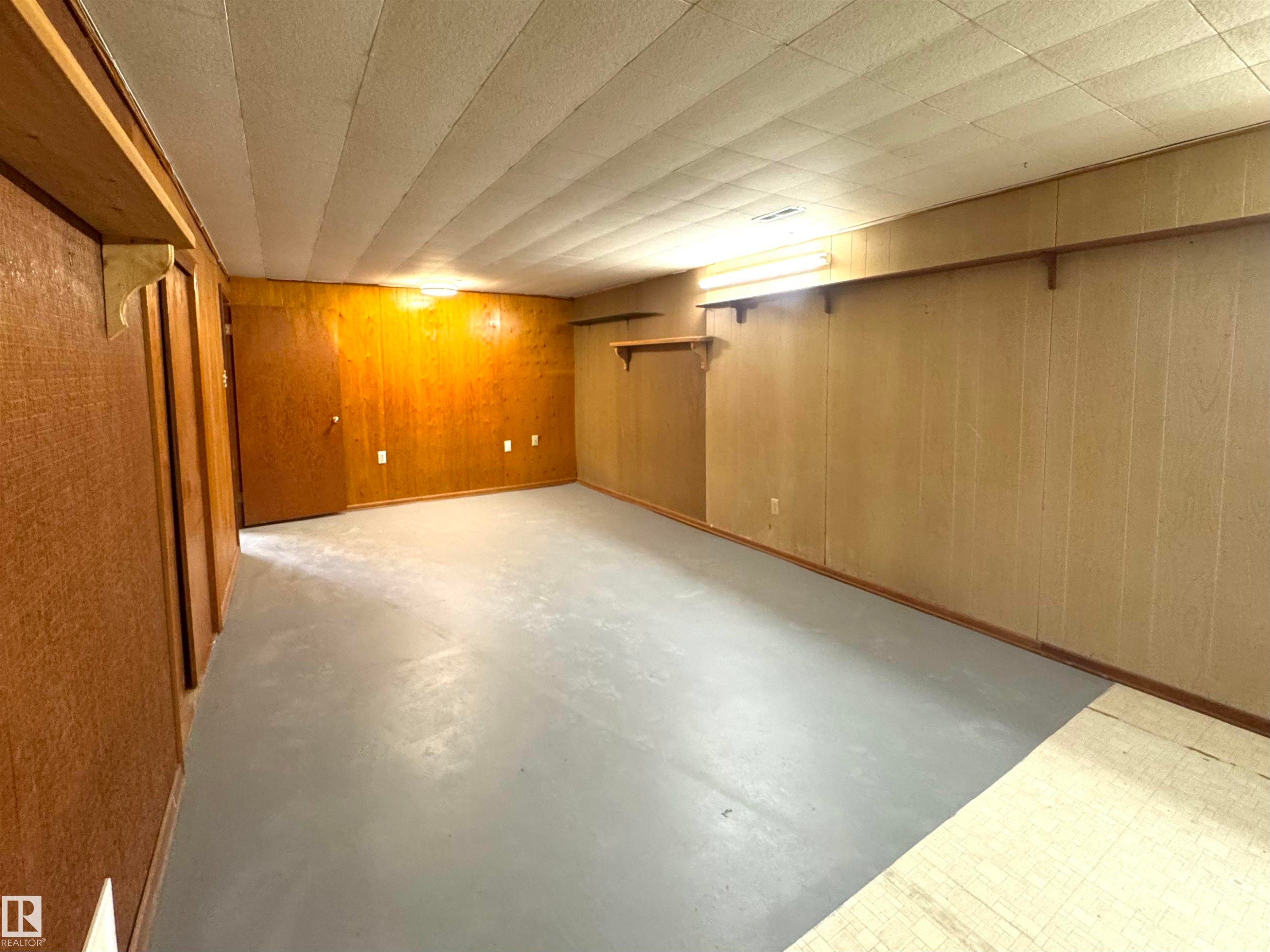 Finished below grade area featuring wood walls - 5140 52 Avenue, Ryley, AB - Indoor Photo Showing Other Room