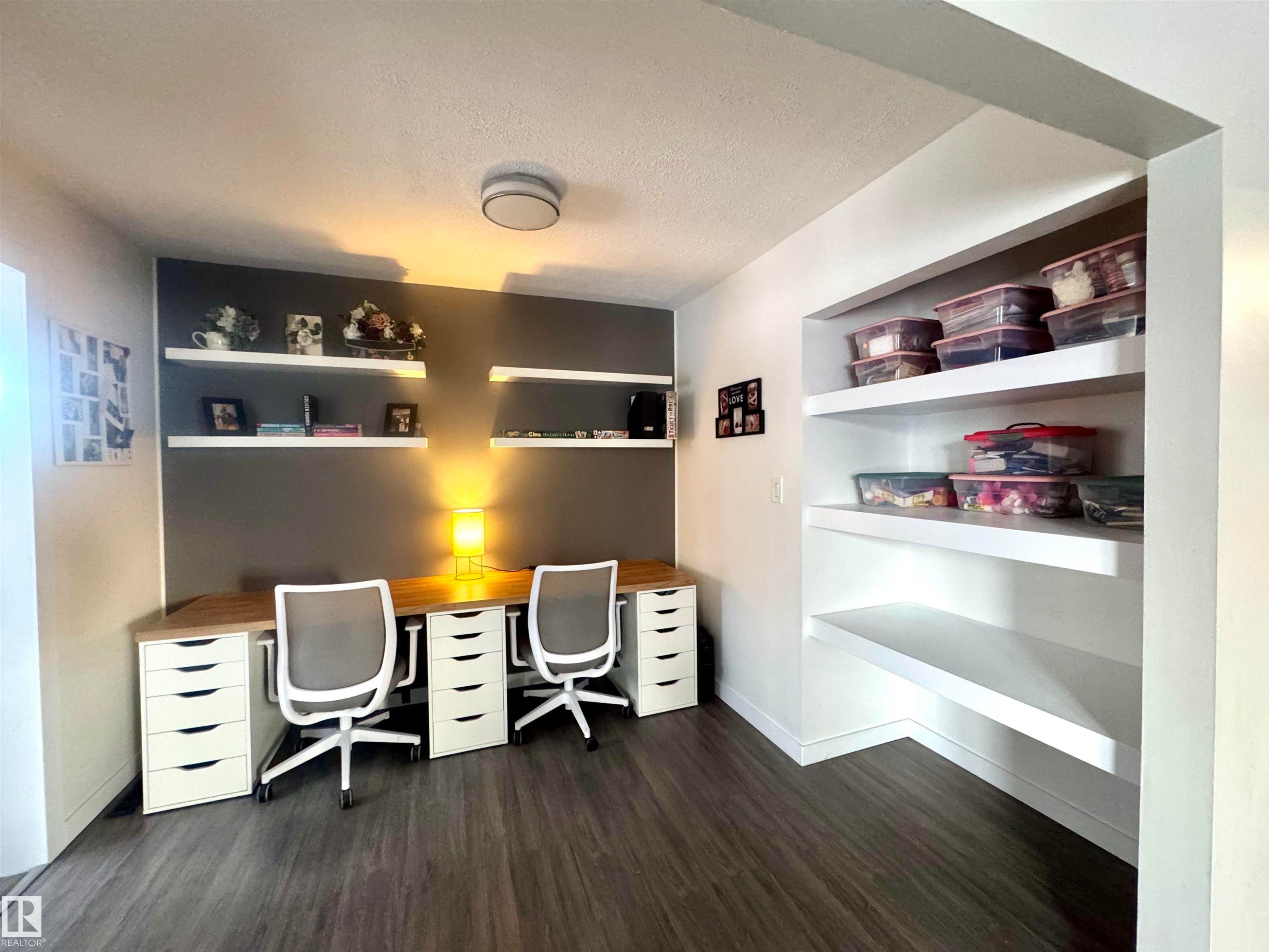 Office with a textured ceiling, dark wood-type flooring, and built in features - 5140 52 Avenue, Ryley, AB - Indoor Photo Showing Office
