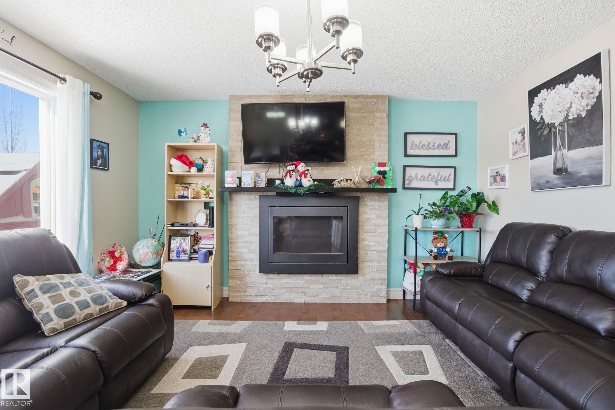 16734 122A Street, Edmonton, AB - Indoor Photo Showing Living Room With Fireplace