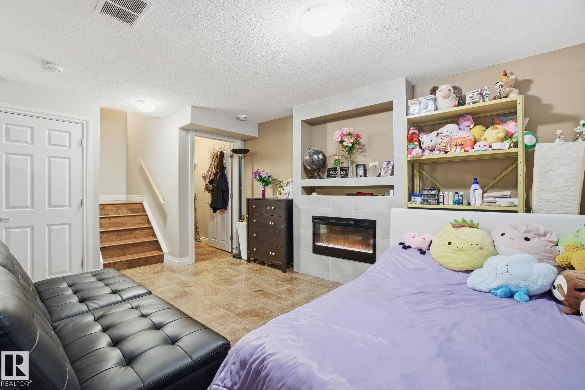 16734 122A Street, Edmonton, AB - Indoor Photo Showing Bedroom With Fireplace