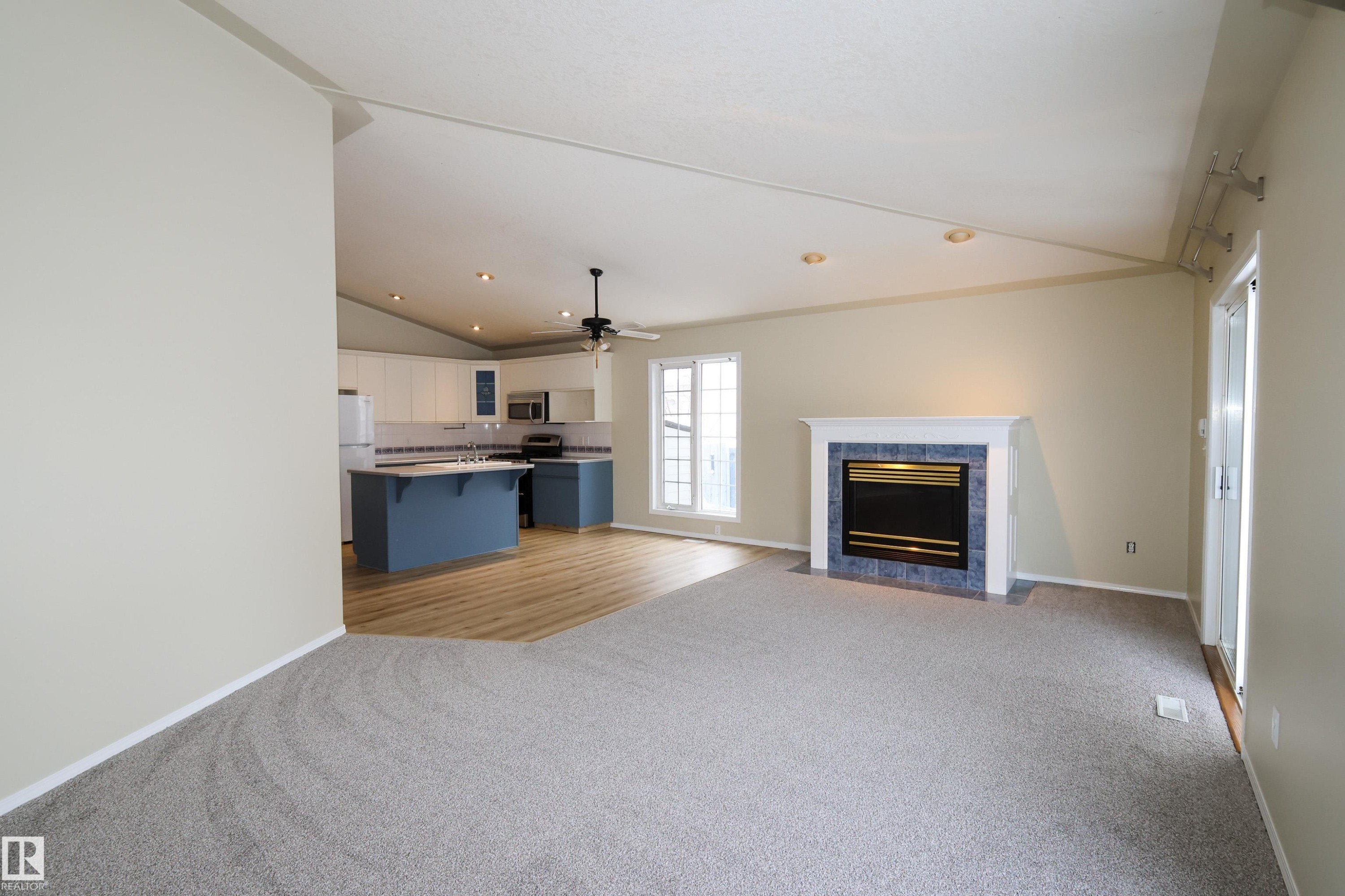 Morinville, AB - Indoor Photo Showing Living Room With Fireplace