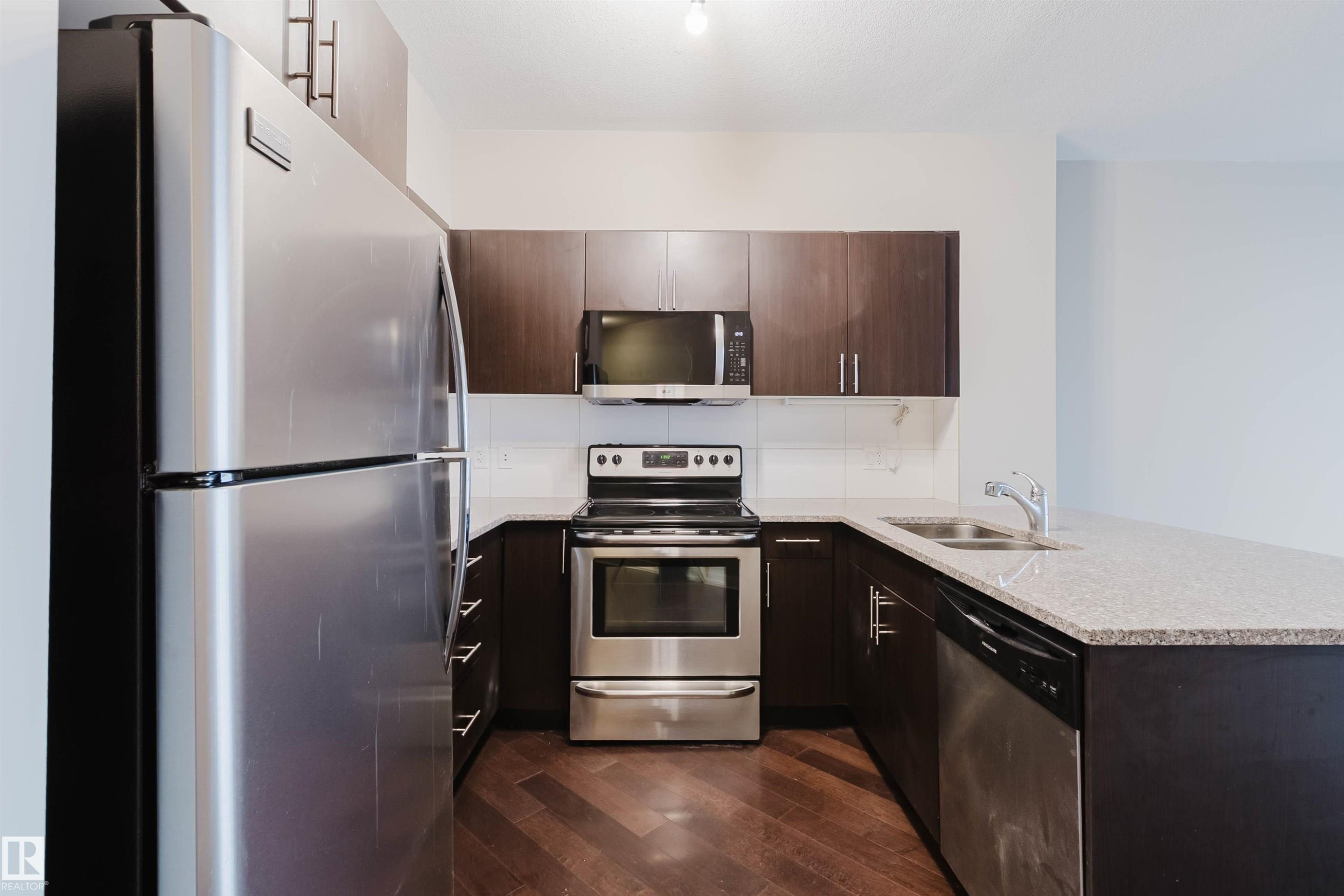 Edmonton, AB - Indoor Photo Showing Kitchen With Stainless Steel Kitchen With Double Sink