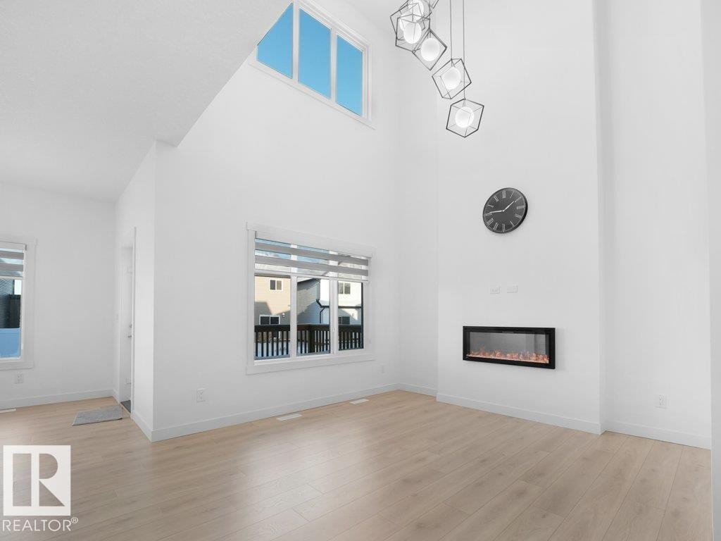 7020 177 Avenue, Edmonton, AB - Indoor Photo Showing Other Room With Fireplace