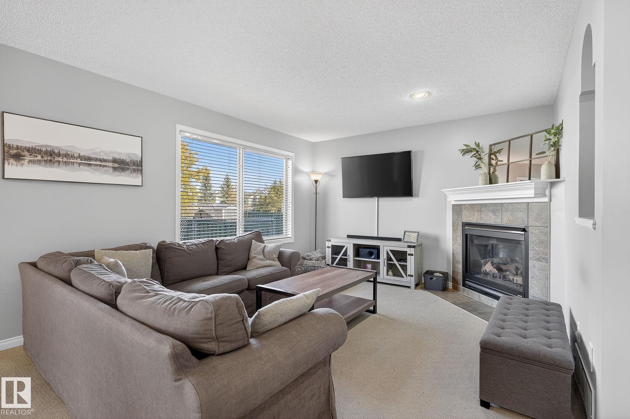 1147 Rutherford Close, Edmonton, AB - Indoor Photo Showing Living Room With Fireplace
