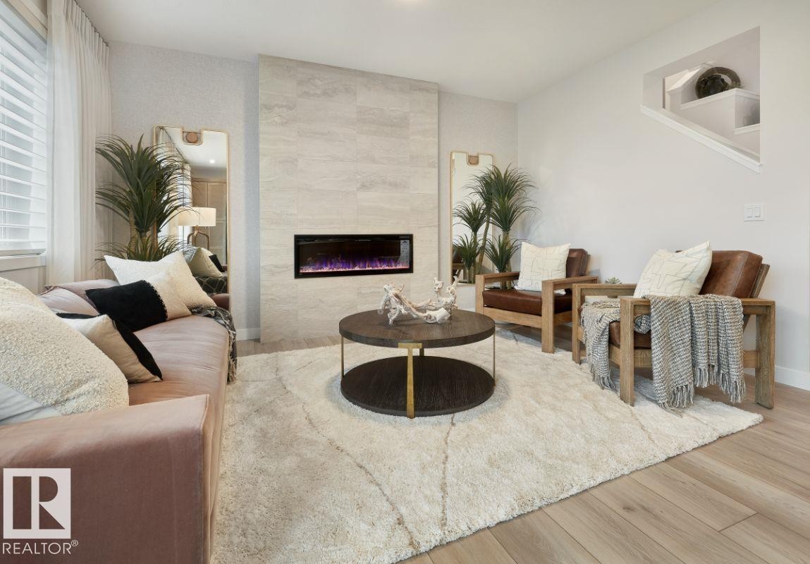 3247 Dixon Way, Edmonton, AB - Indoor Photo Showing Living Room With Fireplace