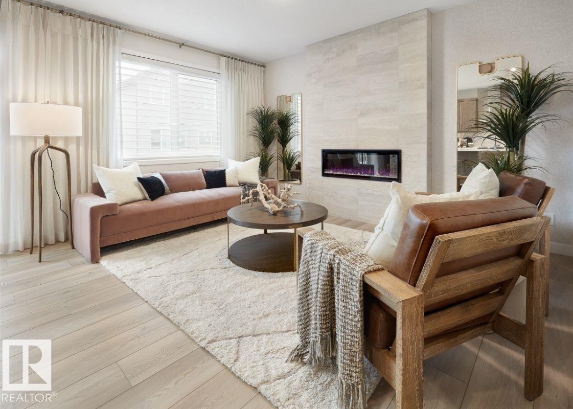 3247 Dixon Way, Edmonton, AB - Indoor Photo Showing Living Room With Fireplace