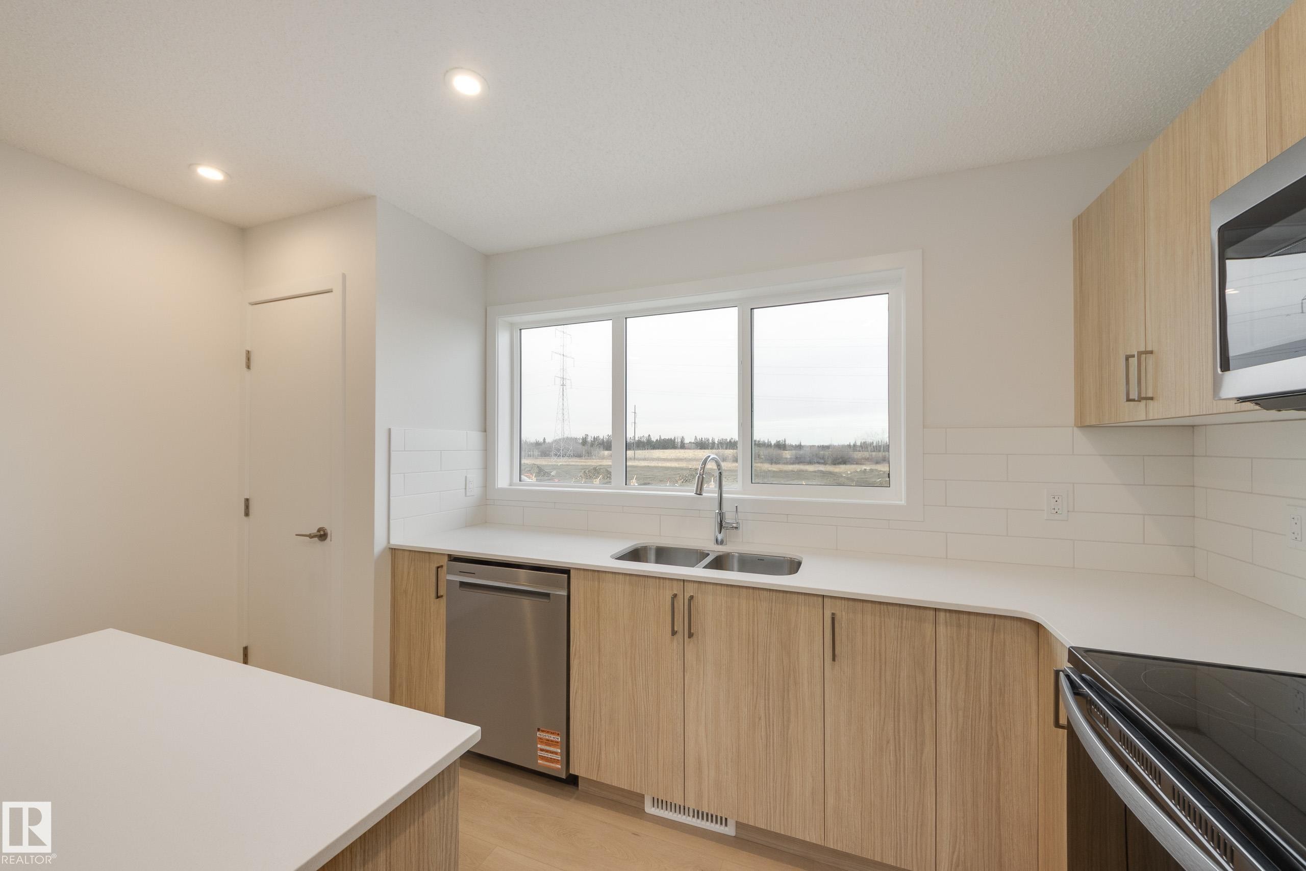 17232 4 Street, Edmonton, AB - Indoor Photo Showing Kitchen With Double Sink