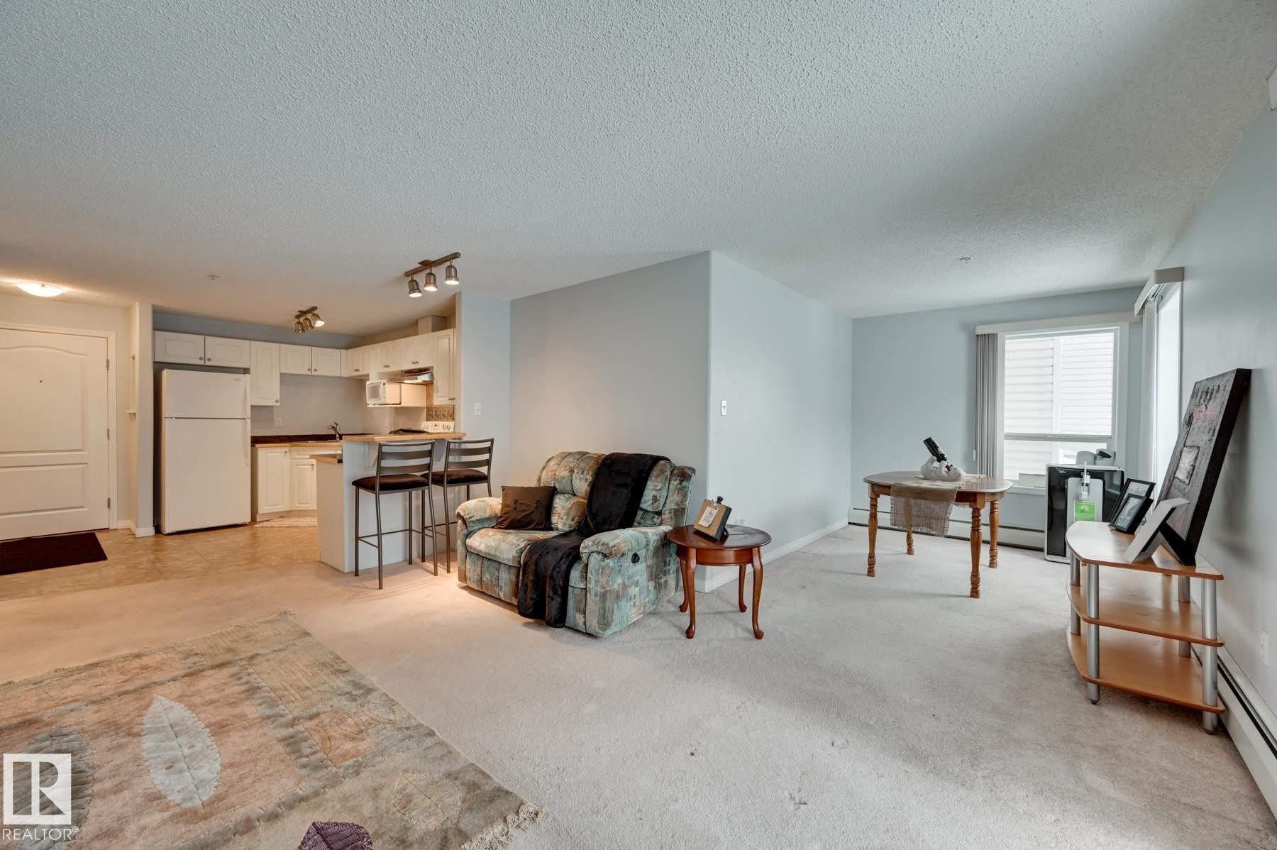 201 155 Edwards Drive, Edmonton, AB - Indoor Photo Showing Living Room