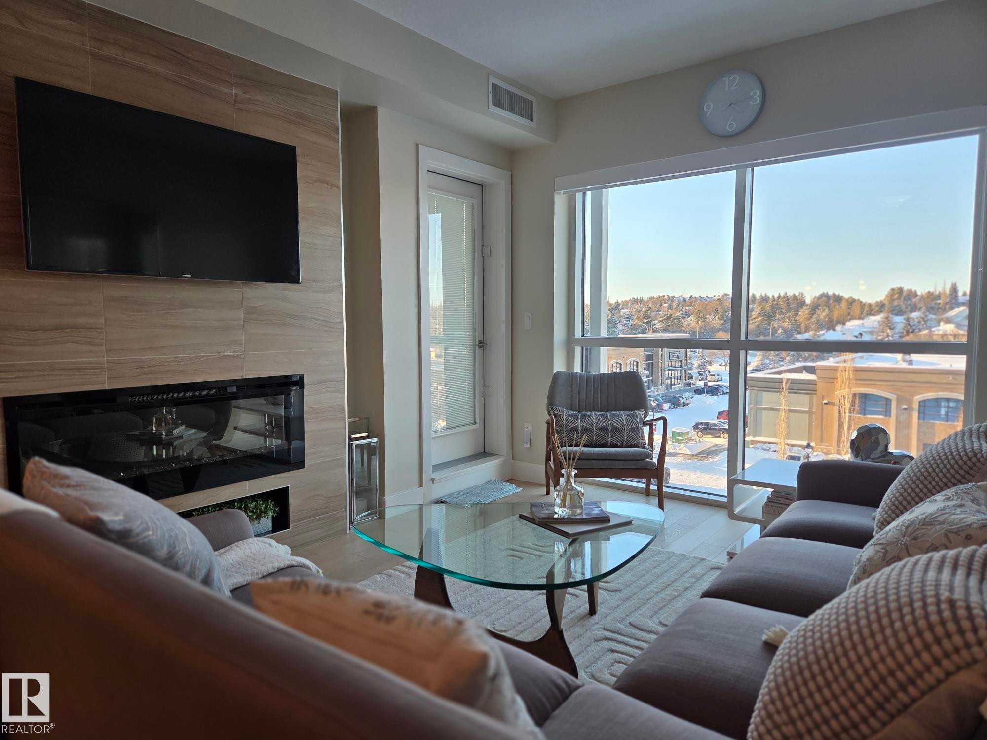 718 200 Bellerose Drive, St. Albert, AB - Indoor Photo Showing Living Room With Fireplace