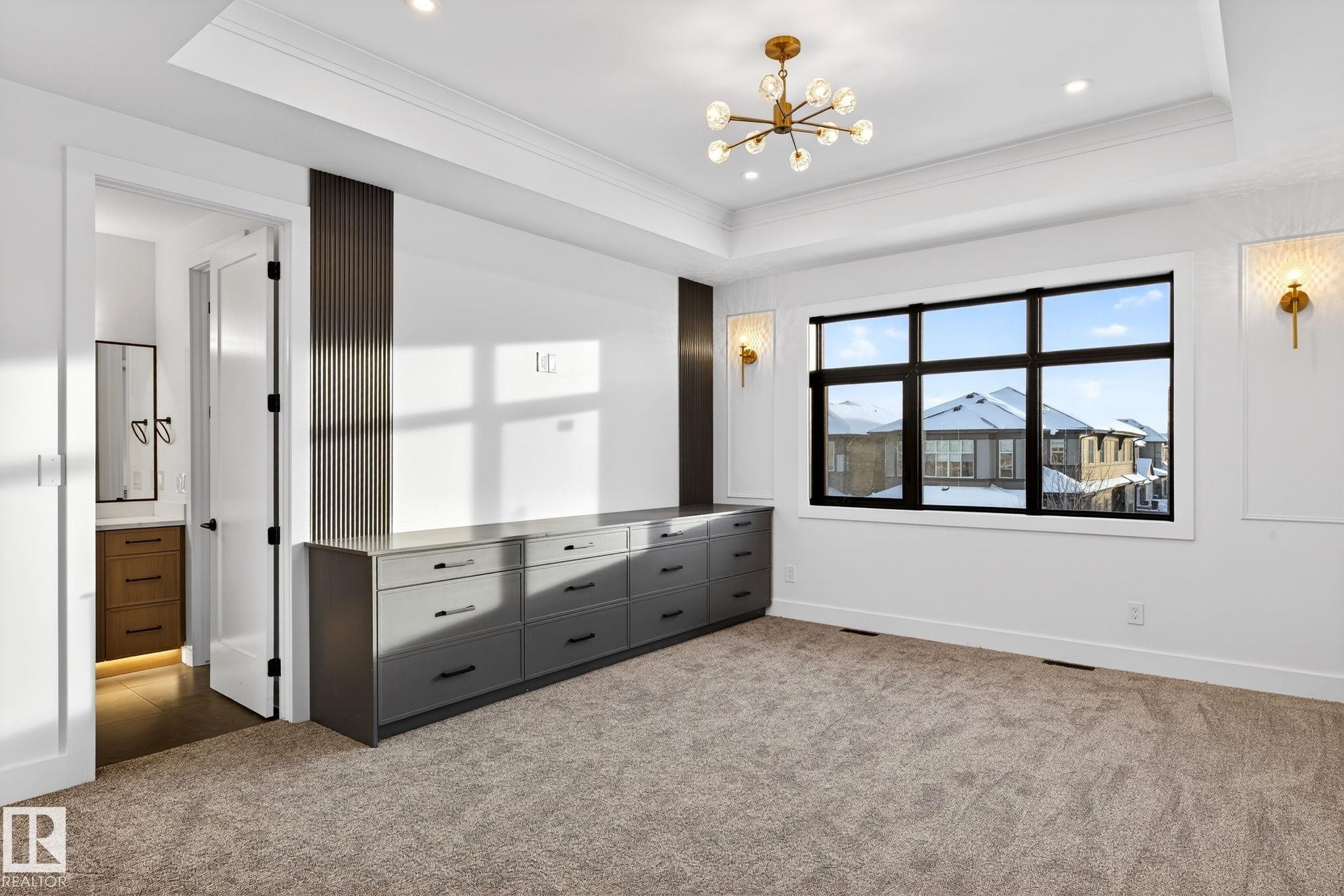 Unfurnished bedroom with a chandelier, carpet, ornamental molding, a raised ceiling, and recessed lighting - 1926 Ainslie Link, Edmonton, AB - Indoor Photo Showing Other Room