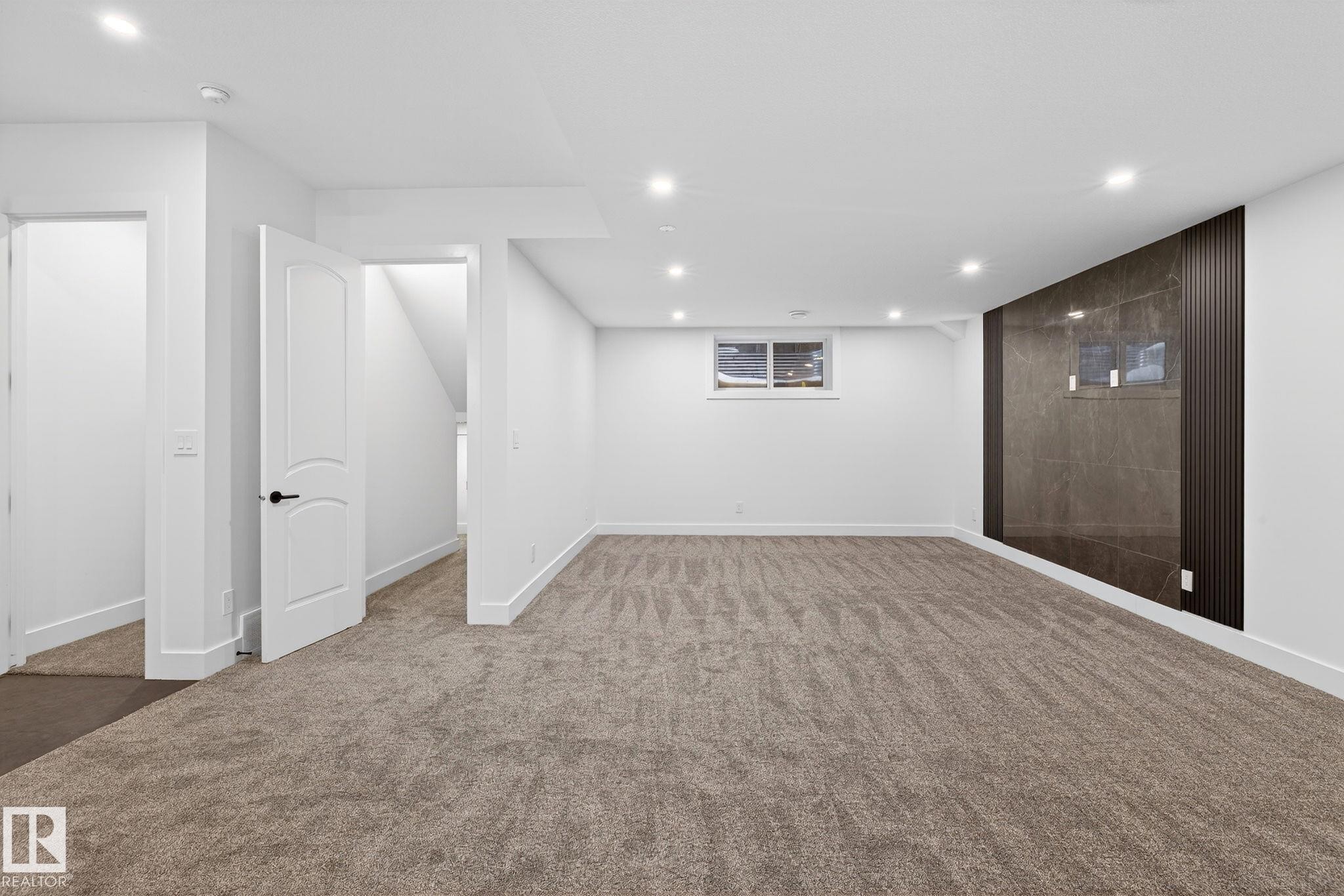 Finished basement featuring recessed lighting and carpet flooring - 1926 Ainslie Link, Edmonton, AB - Indoor