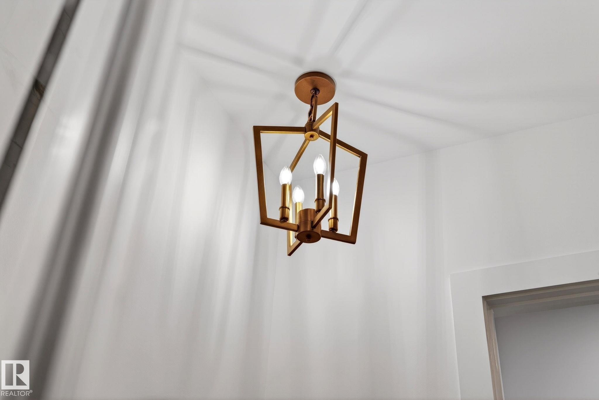 Detailed view of a chandelier - 1926 Ainslie Link, Edmonton, AB - Indoor Photo Showing Other Room