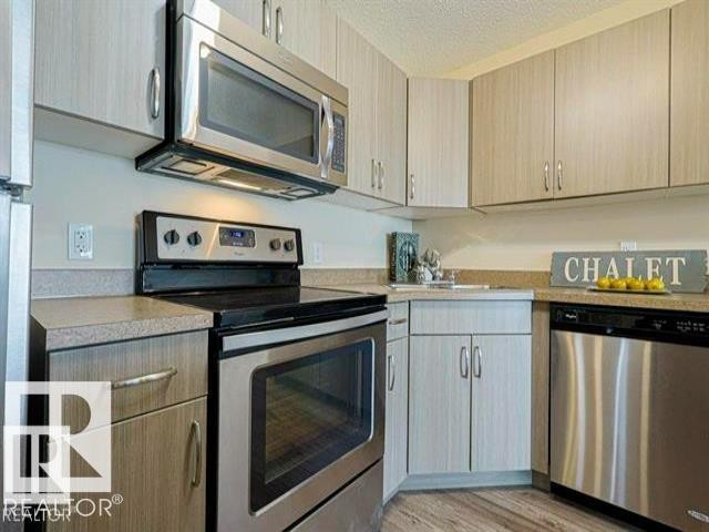 443 301 Clareview Station Drive Nw, Edmonton, AB - Indoor Photo Showing Kitchen With Stainless Steel Kitchen