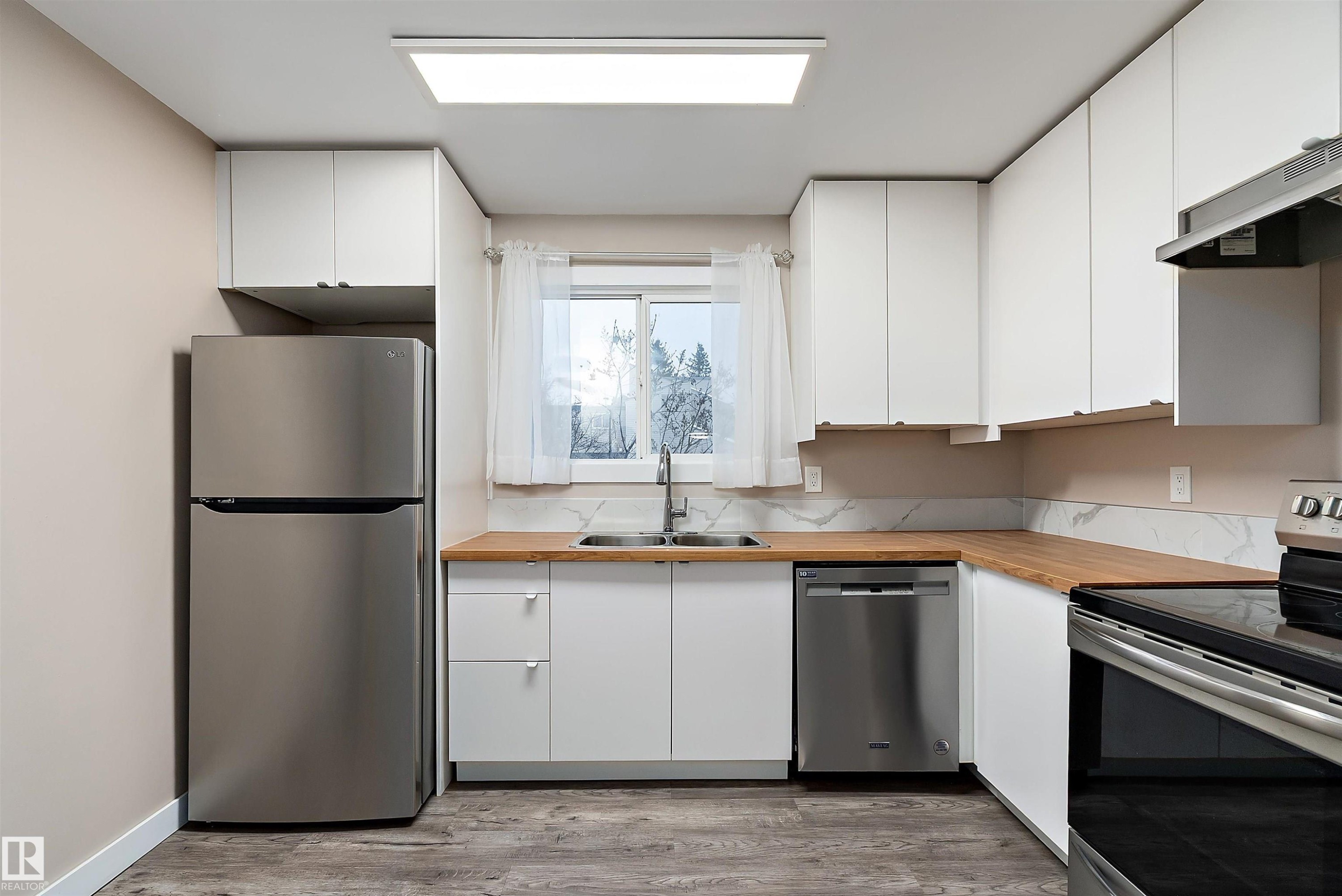 1782 Lakewood Road S, Edmonton, AB - Indoor Photo Showing Kitchen With Stainless Steel Kitchen With Double Sink