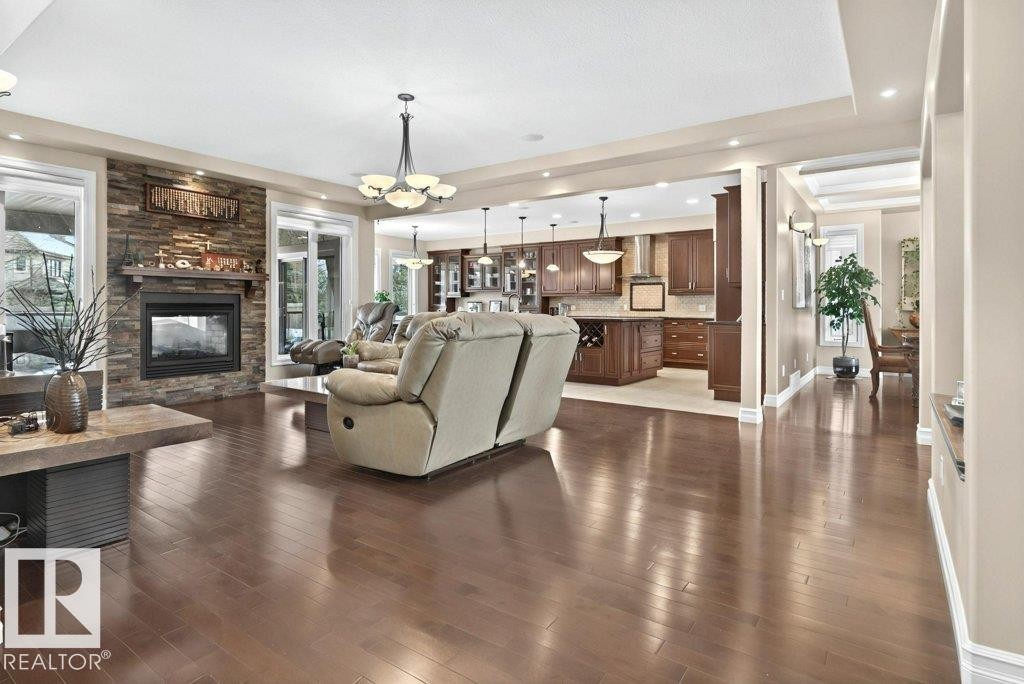 4835 Mactaggart Crest Crest, Edmonton, AB - Indoor Photo Showing Living Room With Fireplace