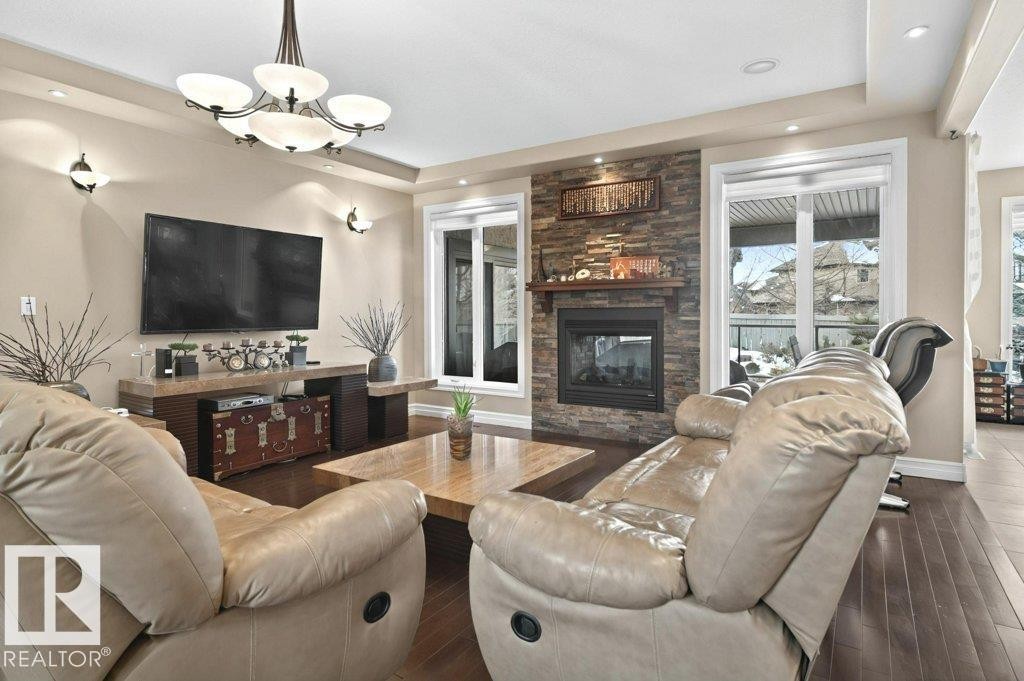 4835 Mactaggart Crest Crest, Edmonton, AB - Indoor Photo Showing Living Room With Fireplace