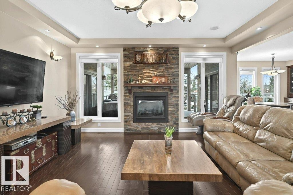 4835 Mactaggart Crest Crest, Edmonton, AB - Indoor Photo Showing Living Room With Fireplace