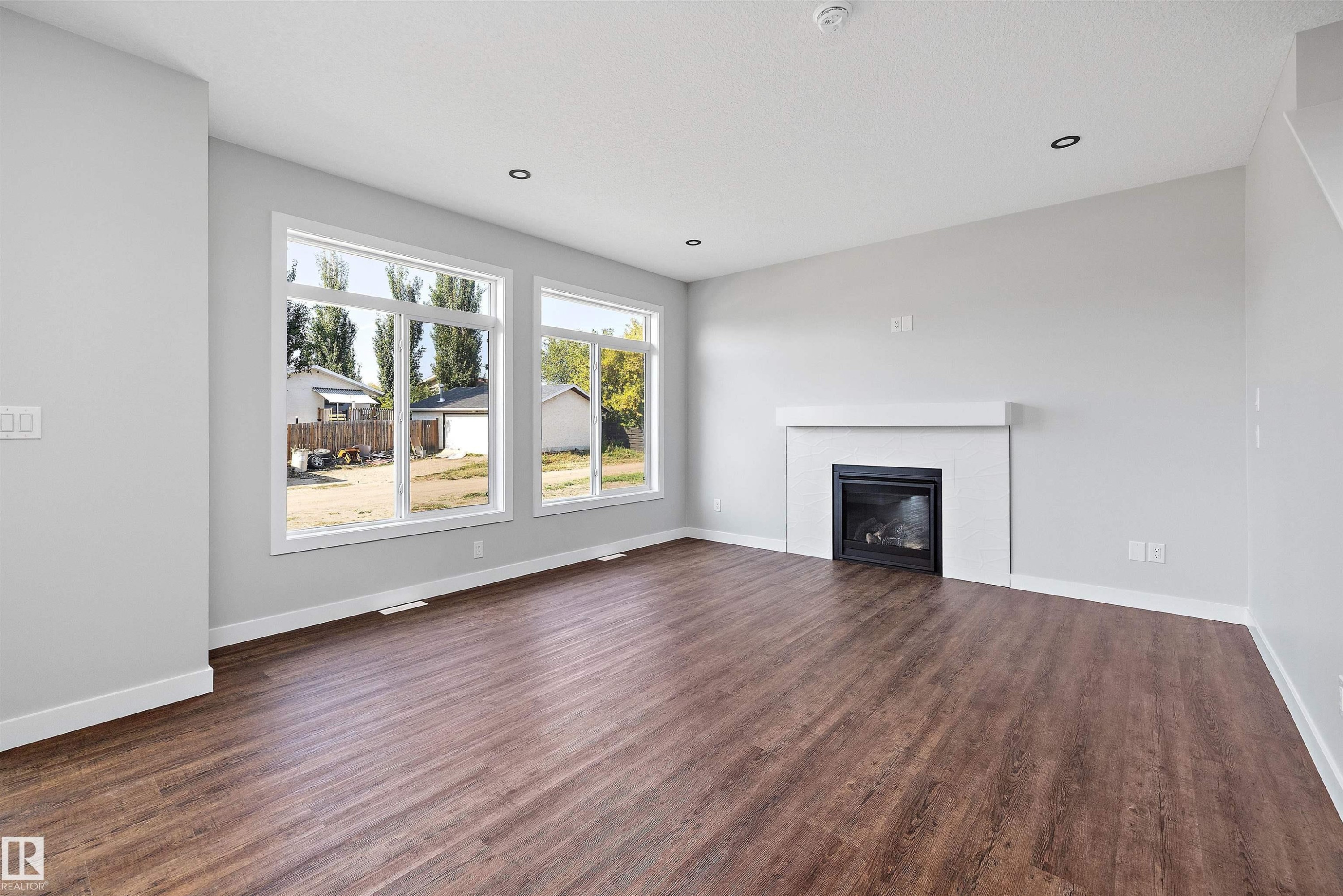 72 Maple Crescent, Gibbons, AB - Indoor Photo Showing Living Room With Fireplace