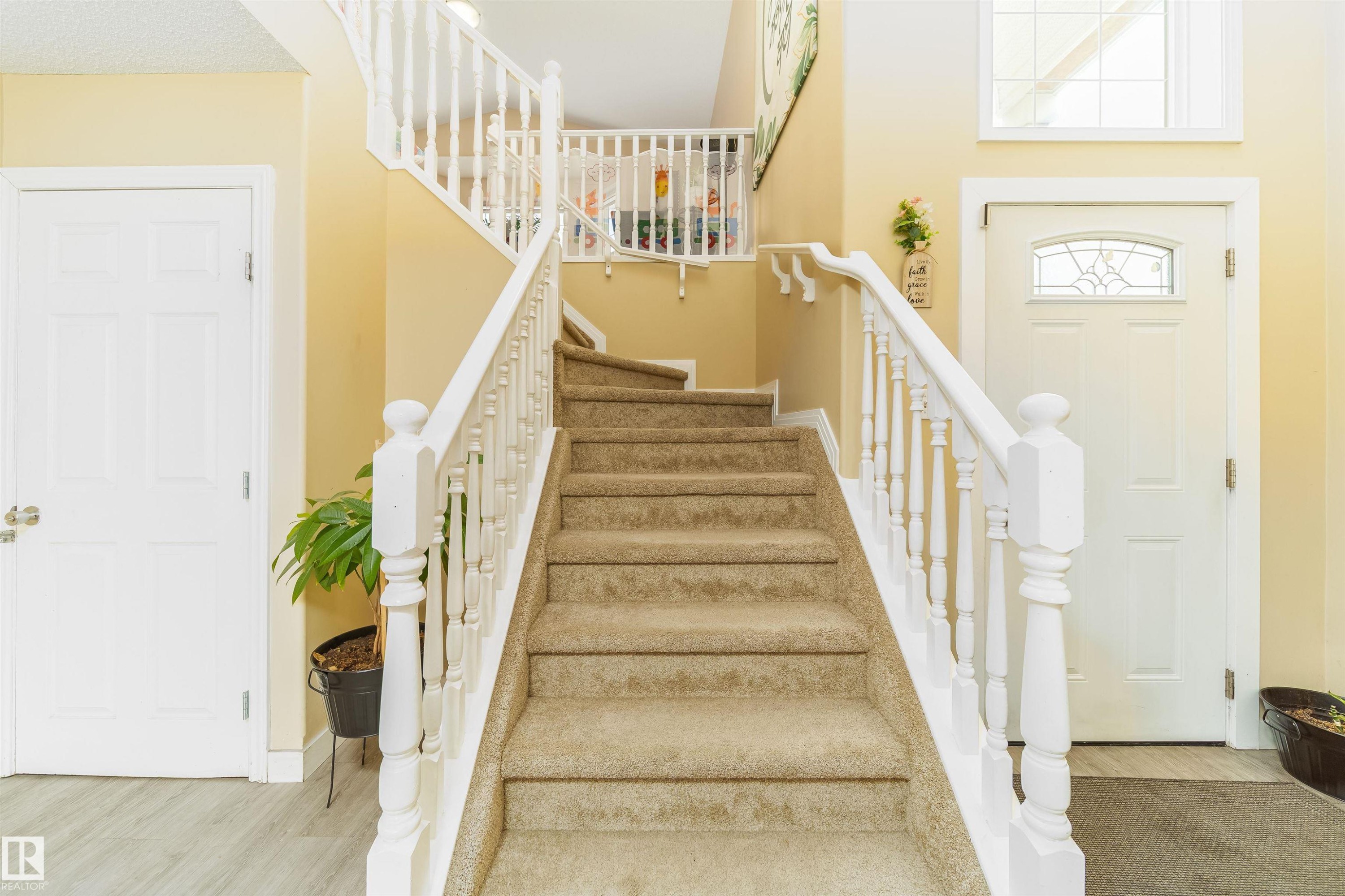 Stairs featuring baseboards - 8518 6 Av, Edmonton, AB - Indoor Photo Showing Other Room