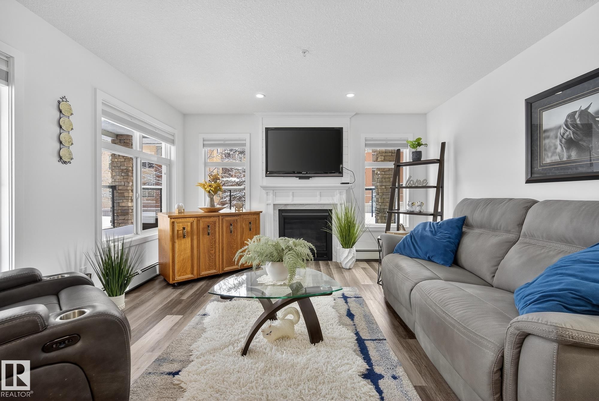 134 11505 Ellerslie Road, Edmonton, AB - Indoor Photo Showing Living Room With Fireplace