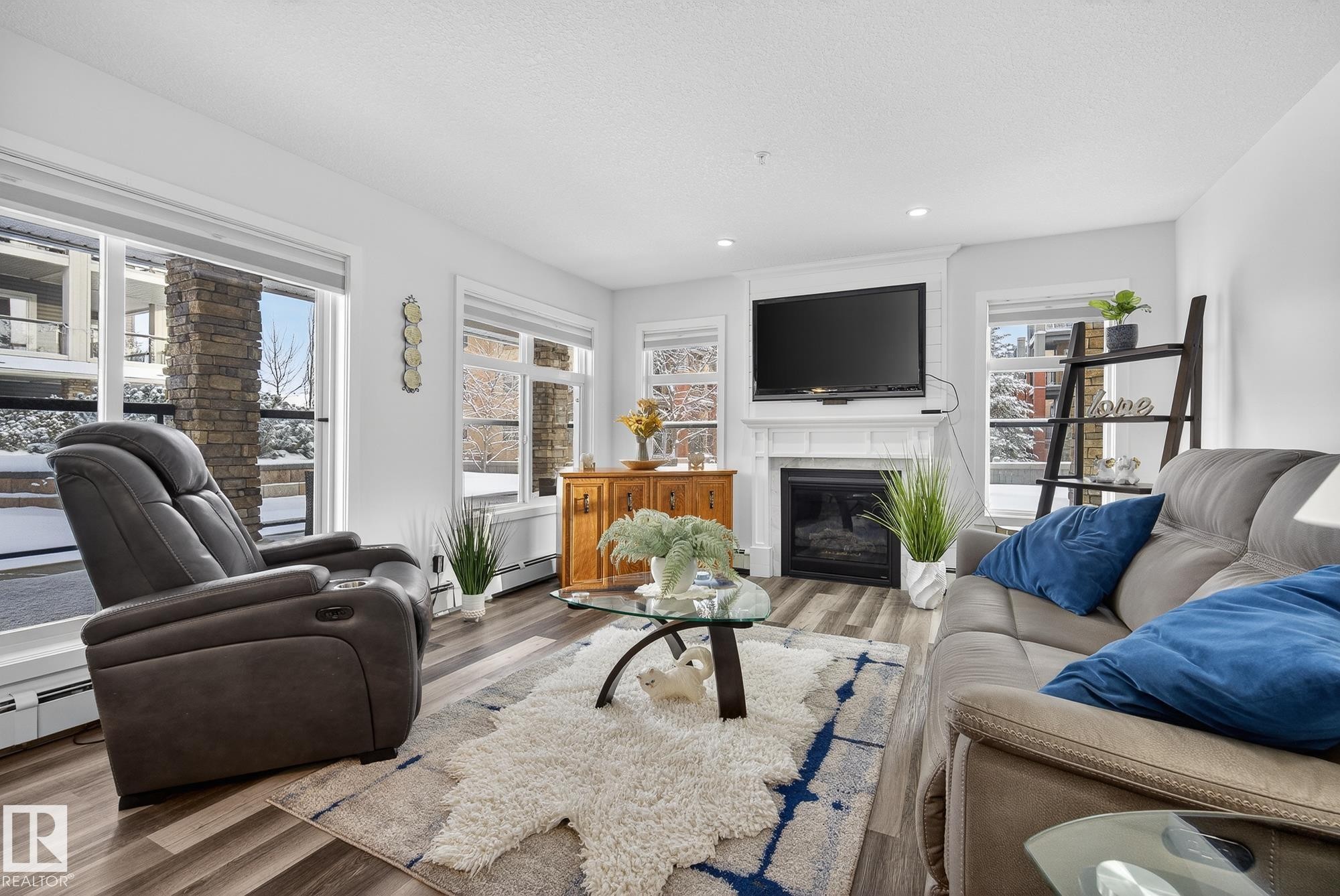 134 11505 Ellerslie Road, Edmonton, AB - Indoor Photo Showing Living Room With Fireplace
