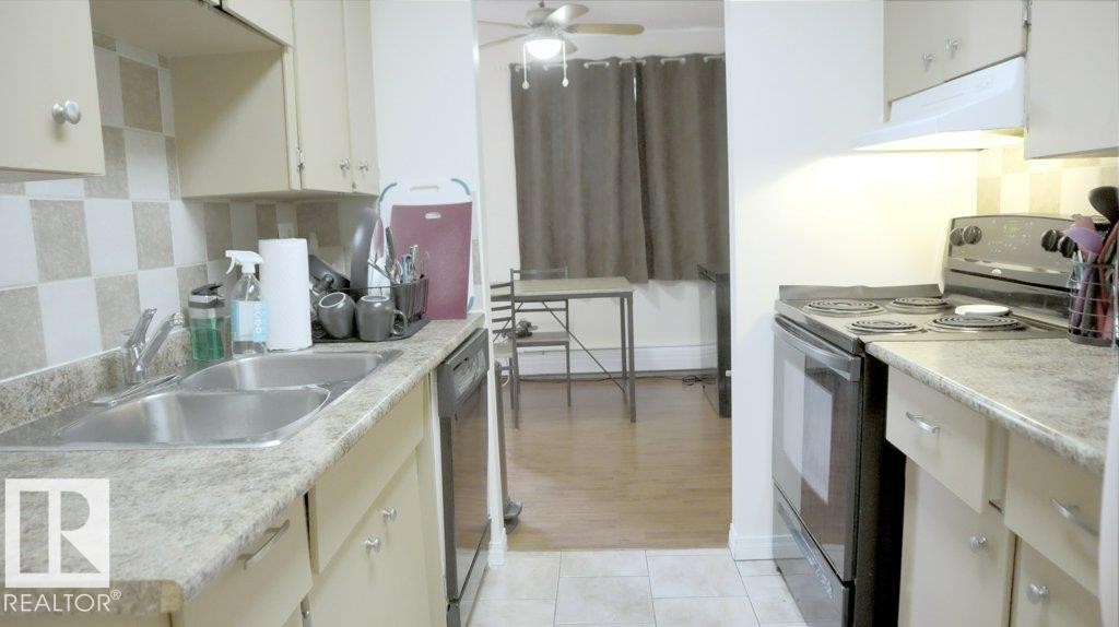 111 5125 Riverbend Road, Edmonton, AB - Indoor Photo Showing Kitchen With Double Sink