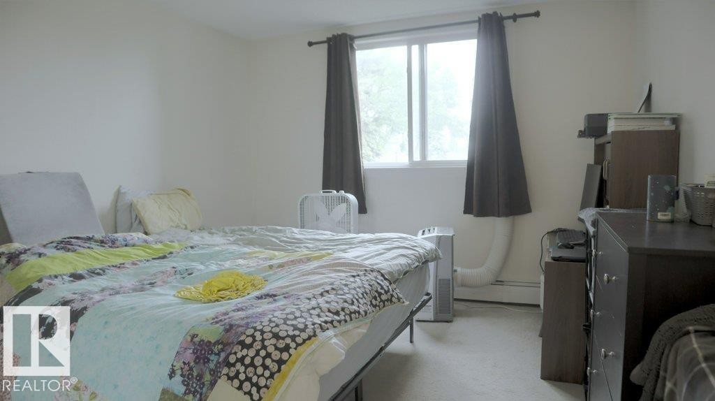 111 5125 Riverbend Road, Edmonton, AB - Indoor Photo Showing Bedroom
