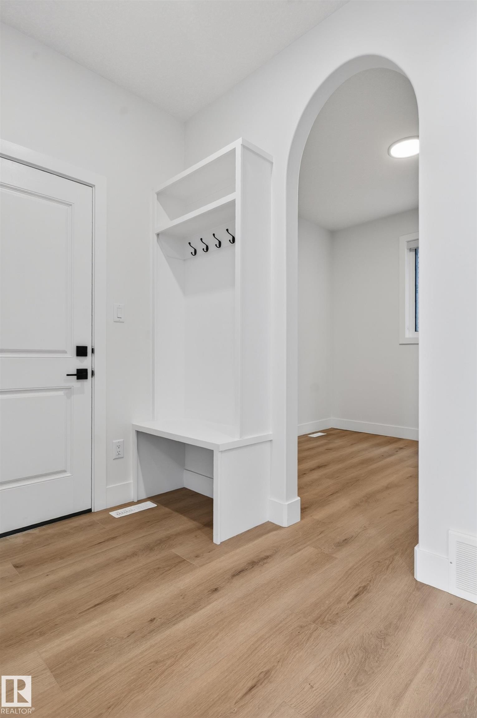 Entryway featuring a built-in bench with storage and coat hooks - 27 Redpoll Wynd, St. Albert, AB - Indoor Photo Showing Other Room