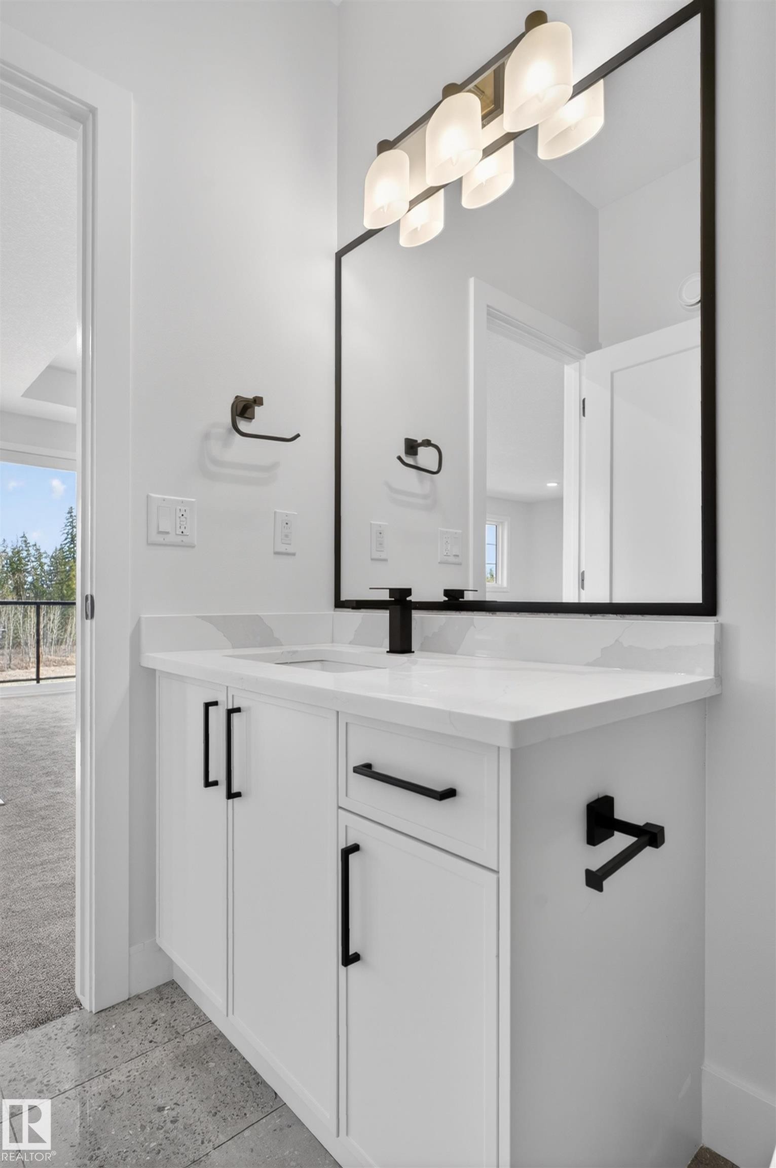 Contemporary bathroom vanity with a white countertop and integrated sink - 27 Redpoll Wynd, St. Albert, AB - Indoor