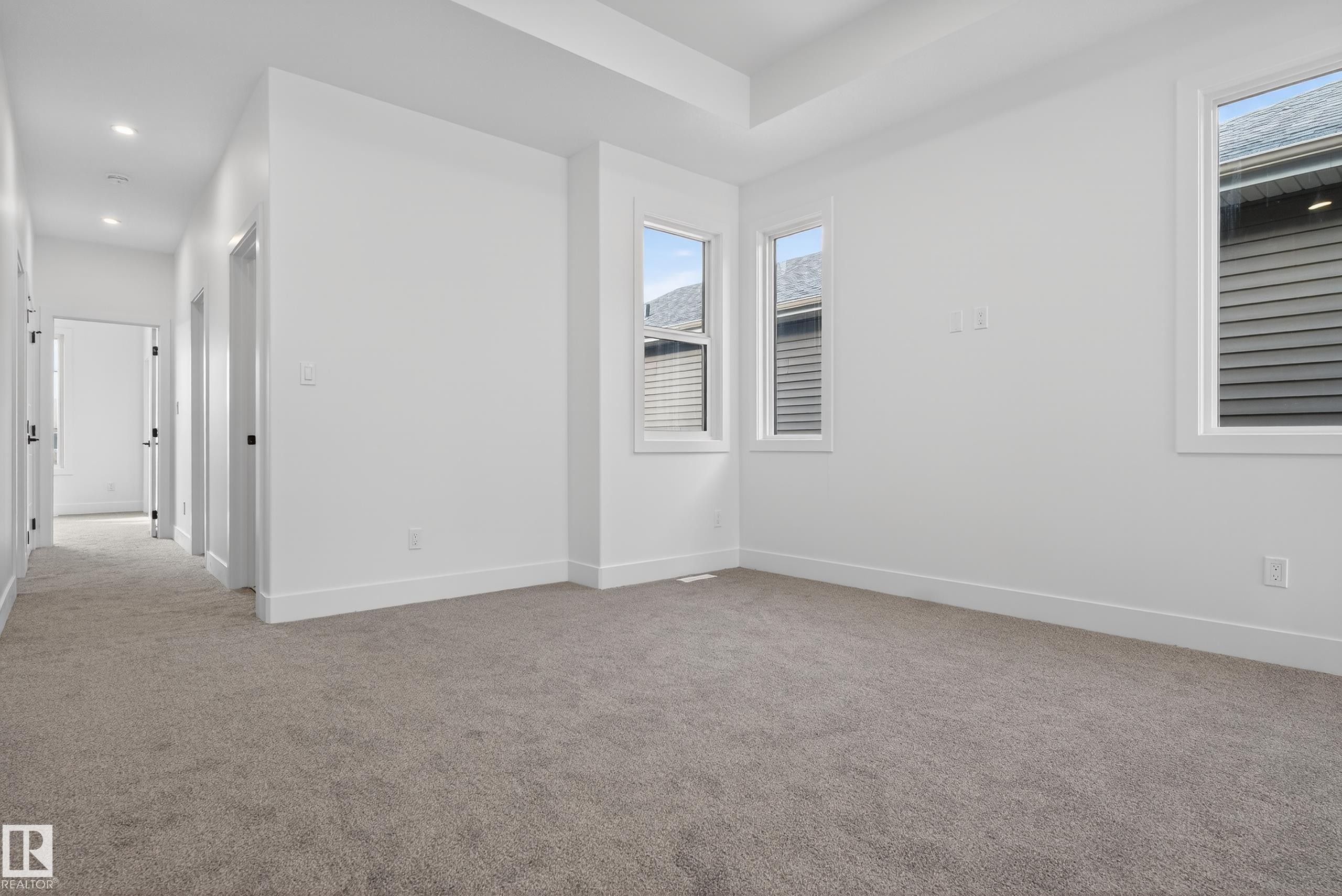 Spare room featuring light carpet and recessed lighting - 19 Rosa Crescent, St. Albert, AB - Indoor Photo Showing Other Room