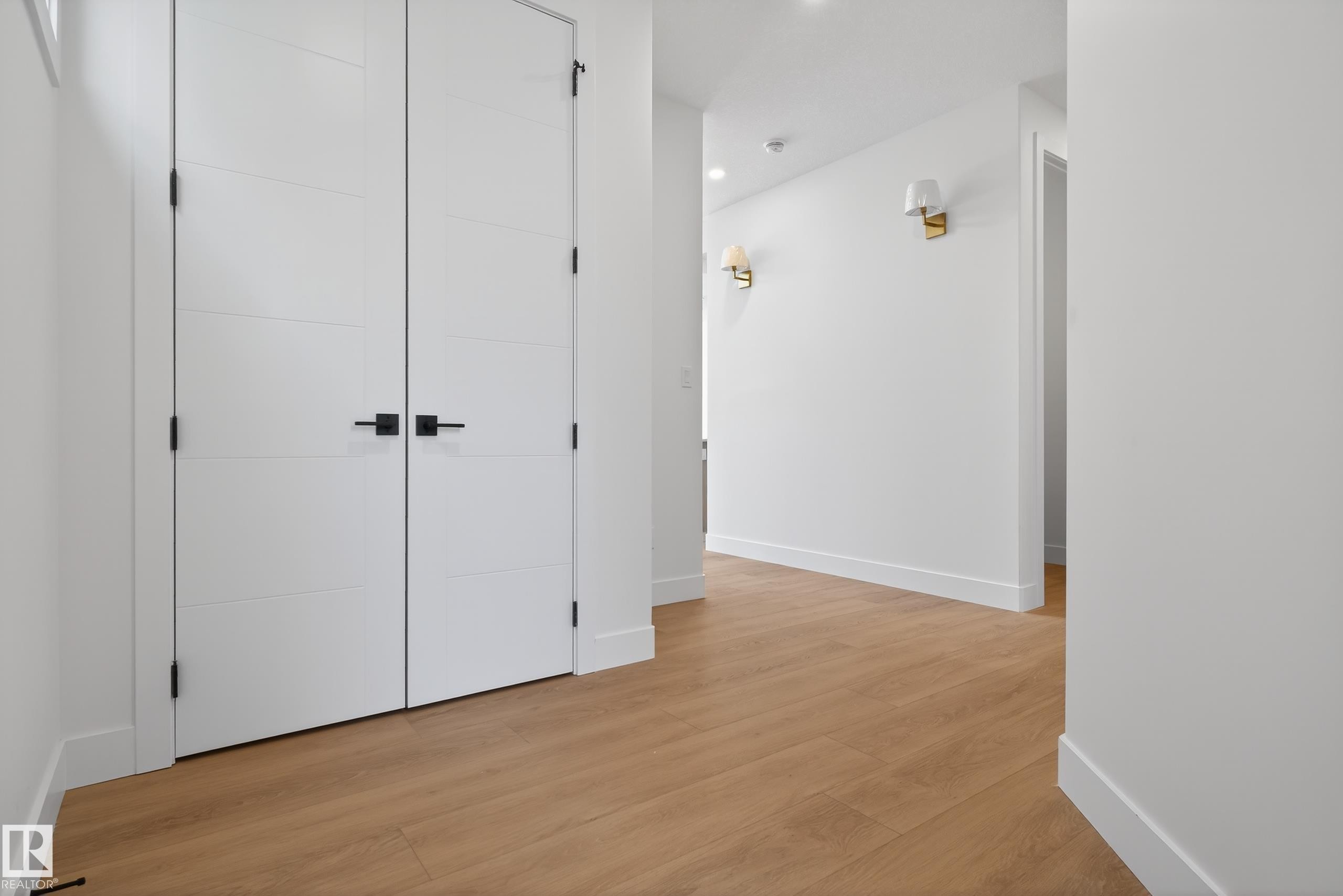 Hall featuring light wood-style floors and recessed lighting - 19 Rosa Crescent, St. Albert, AB - Indoor Photo Showing Other Room