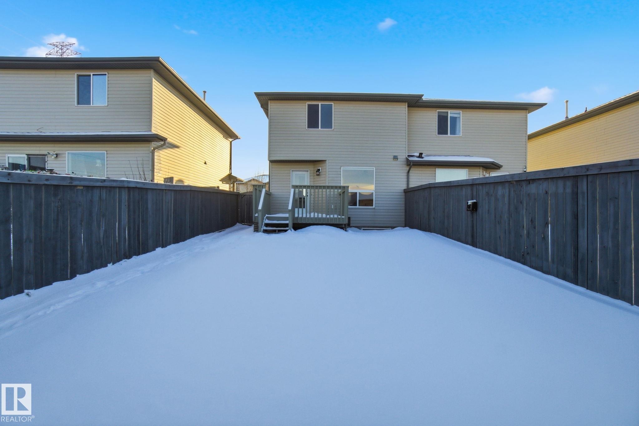 Back of house with a wooden deck and a fenced backyard - 3014 31 Avenue, Edmonton, AB - Outdoor With Exterior