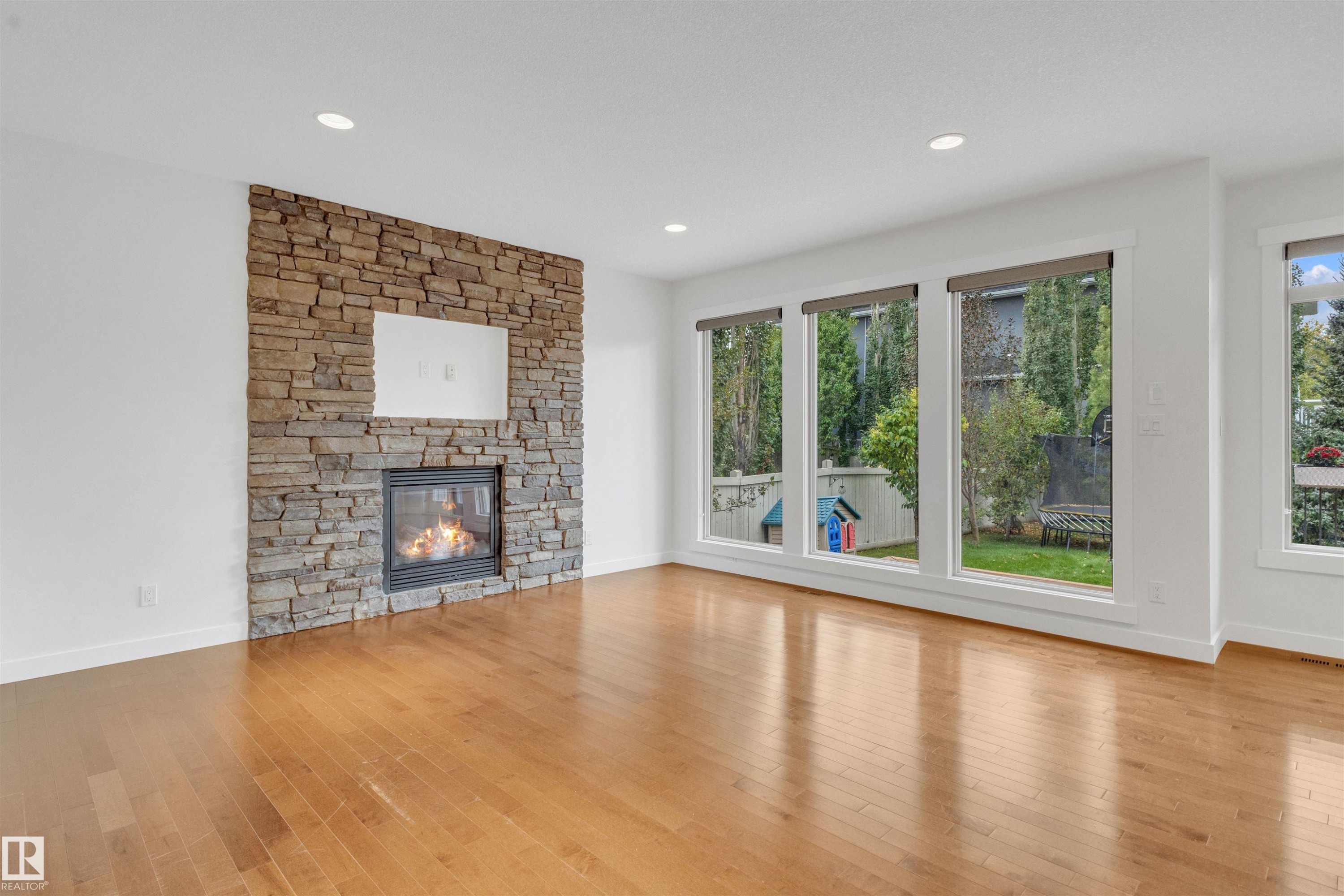 Edmonton, AB - Indoor Photo Showing Living Room With Fireplace