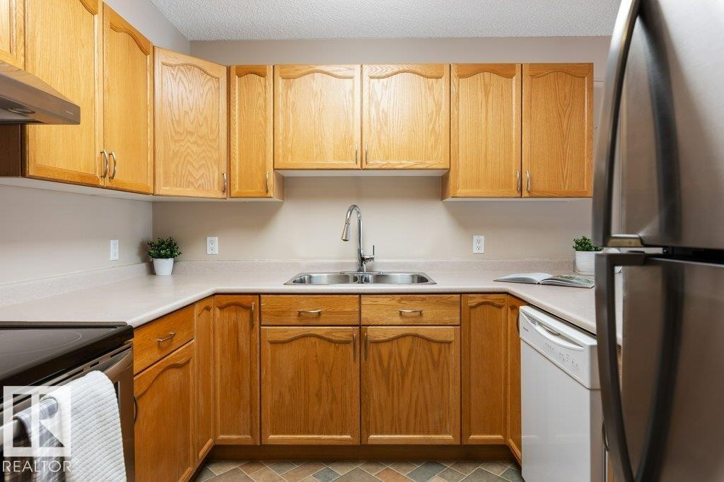 St. Albert, AB - Indoor Photo Showing Kitchen With Double Sink