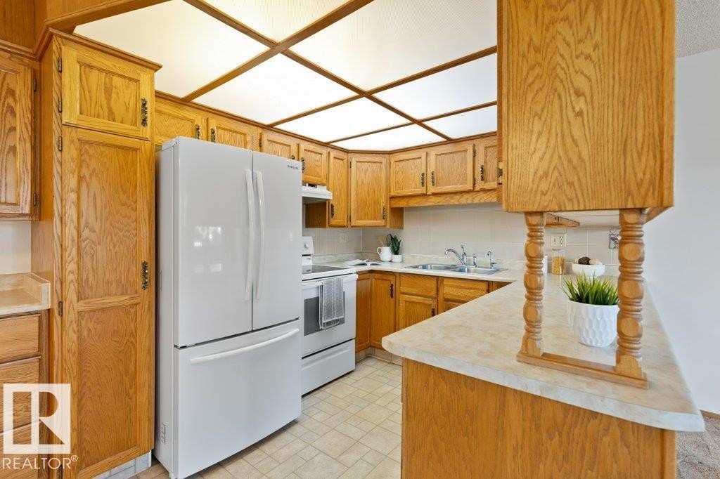 Edmonton, AB - Indoor Photo Showing Kitchen With Double Sink