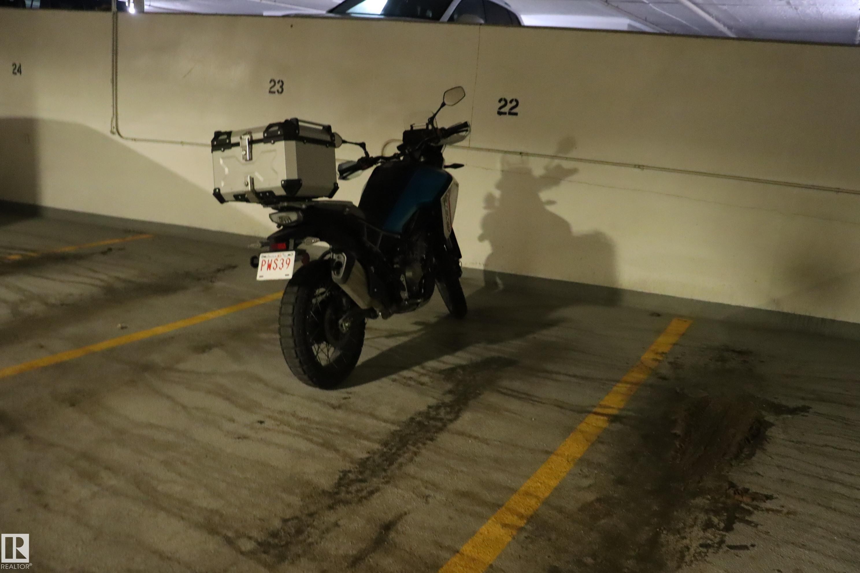 Underground parking stall for one car on main level just 50 feet from entrance to garage. - #203 9028 Jasper Ave Nw, Edmonton, AB - Indoor Photo Showing Garage