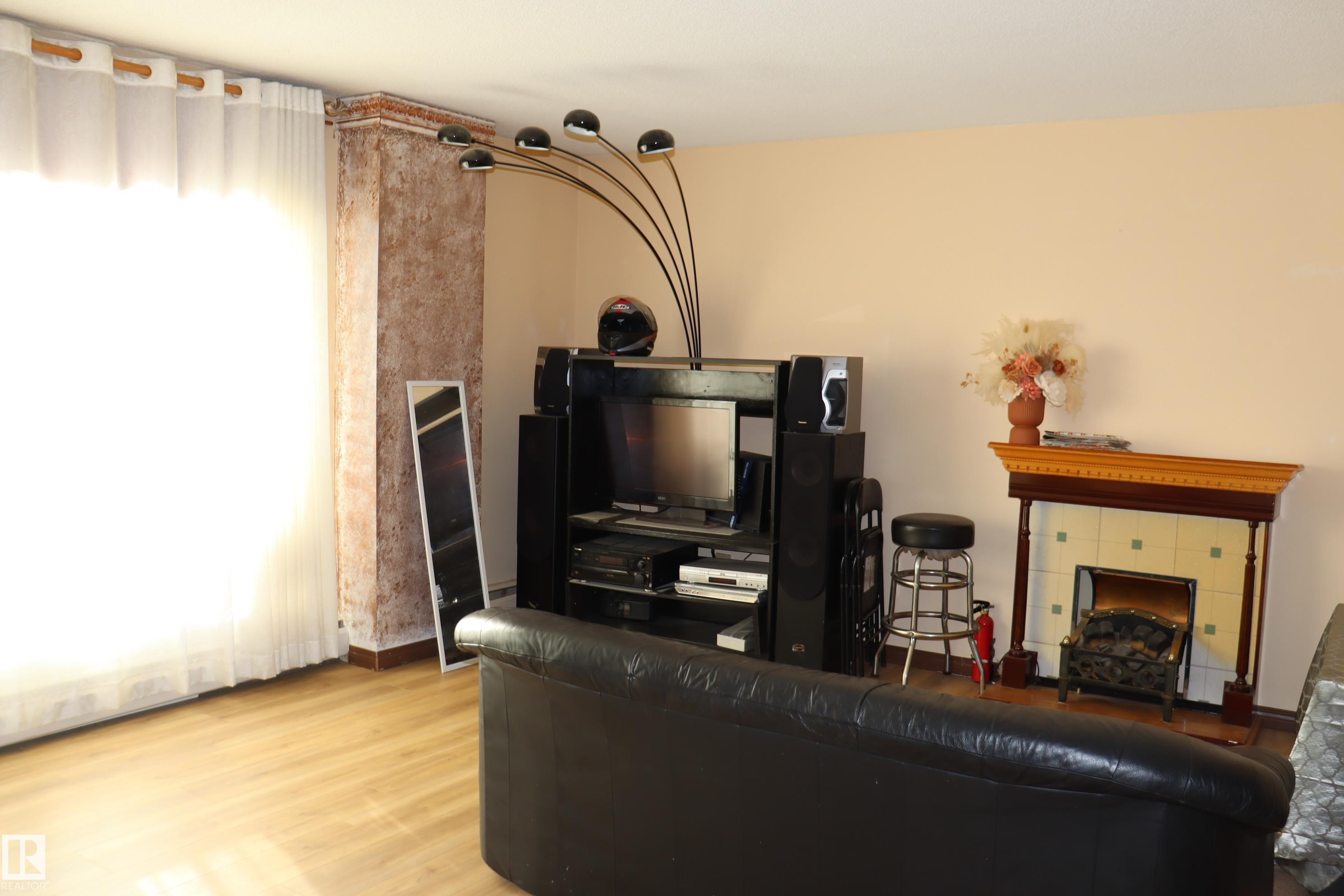 #203 9028 Jasper Ave Nw, Edmonton, AB - Indoor With Fireplace