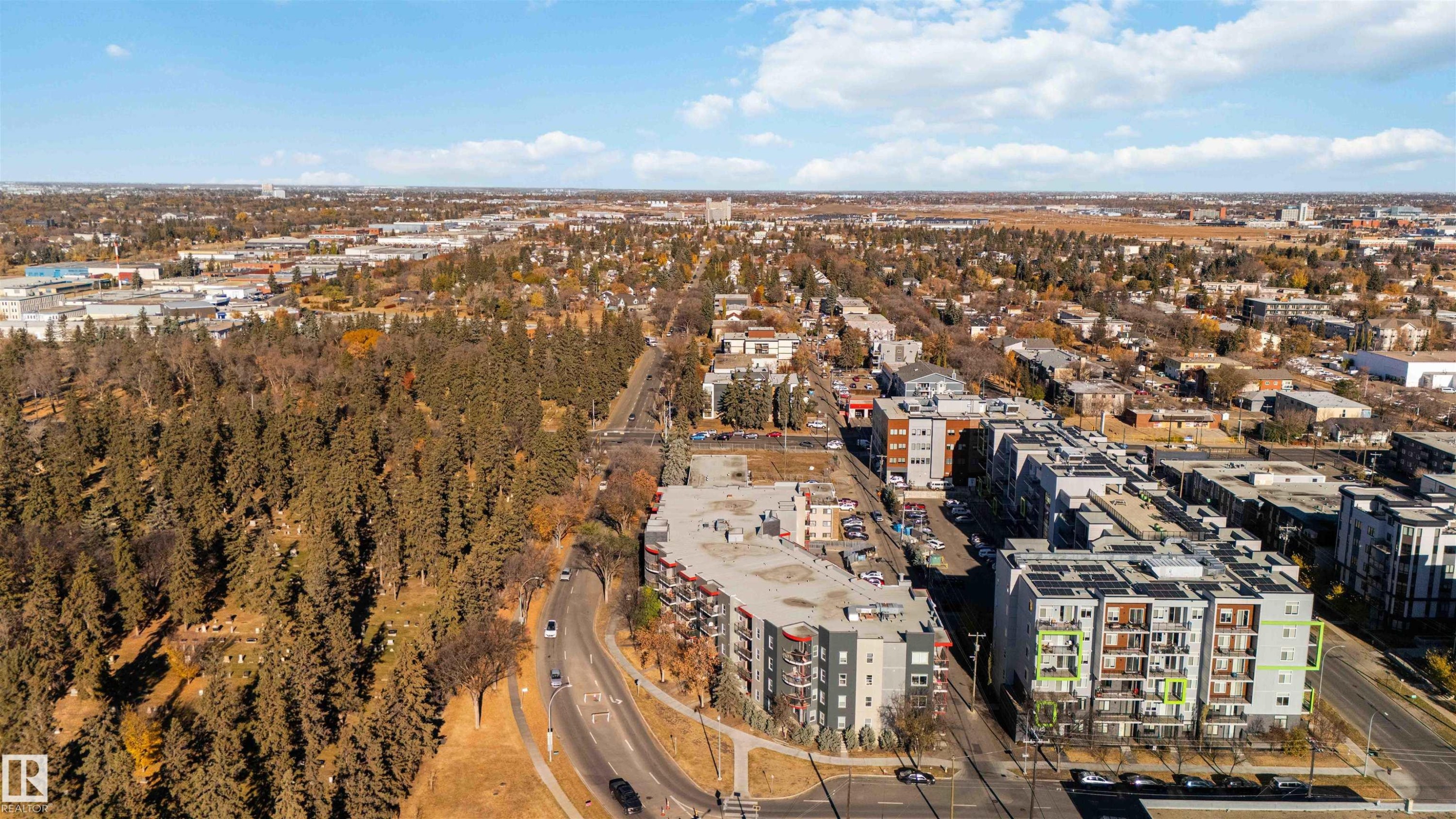 Aerial overview of property's location with nearby urban area - 107 10611 117 Street, Edmonton, AB - Outdoor With View